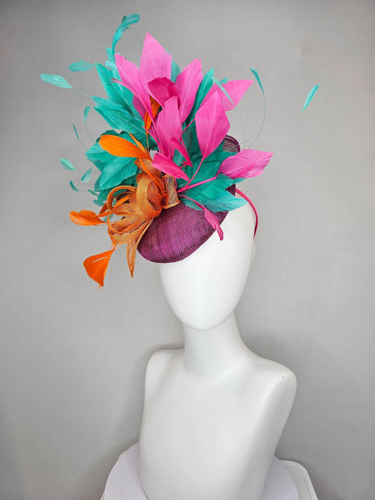 kentucky derby hat fascinator magenta purple sinamay with orange sinamay bow and orange feathers,pink and aqua blue green branching feathers