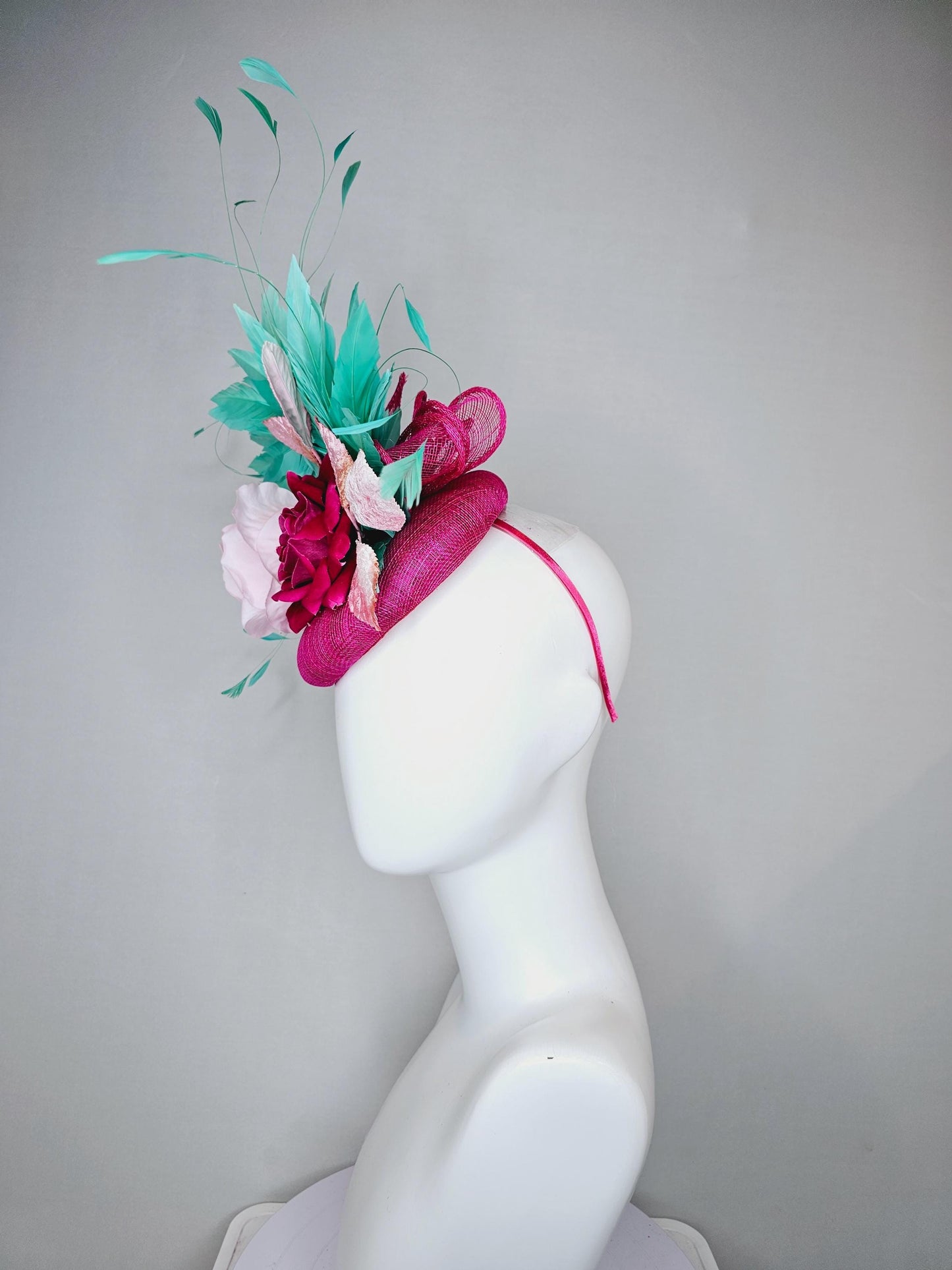 kentucky derby hat fascinator pink sinamay with light pink fuchsia satin silk rose flowers and baby pink leaves,aqua blue branching feathers