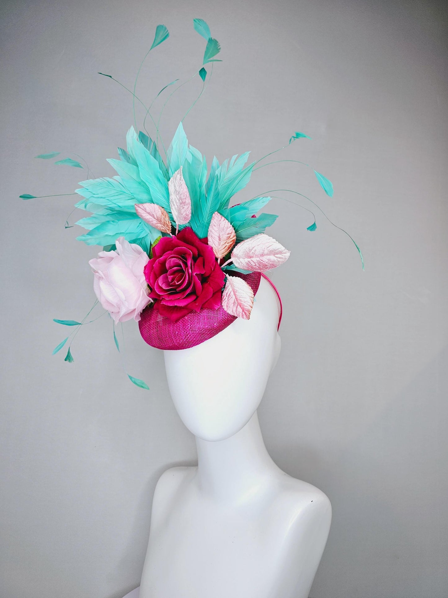 kentucky derby hat fascinator pink sinamay with light pink fuchsia satin silk rose flowers and baby pink leaves,aqua blue branching feathers