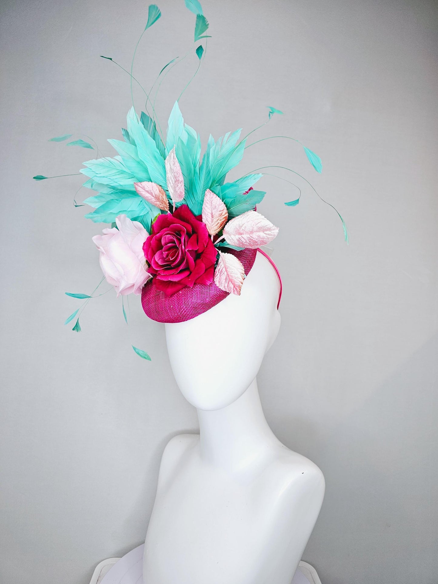 kentucky derby hat fascinator pink sinamay with light pink fuchsia satin silk rose flowers and baby pink leaves,aqua blue branching feathers