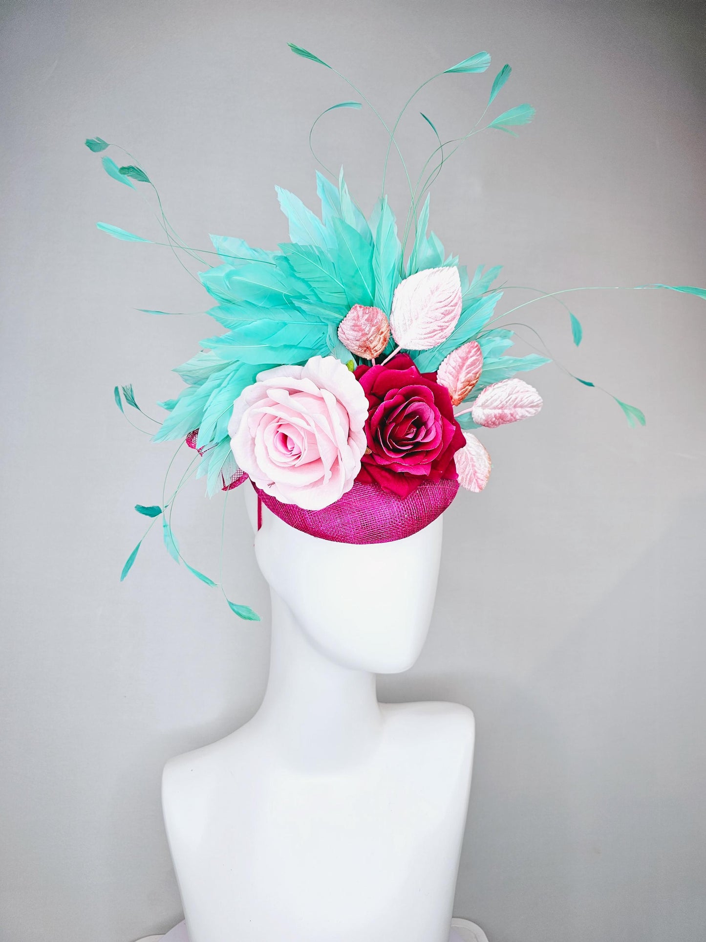 kentucky derby hat fascinator pink sinamay with light pink fuchsia satin silk rose flowers and baby pink leaves,aqua blue branching feathers