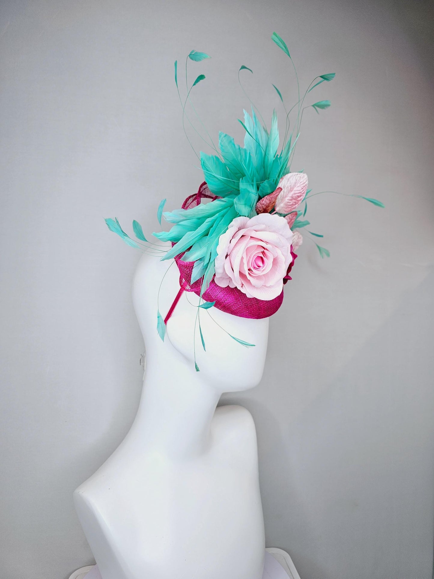 kentucky derby hat fascinator pink sinamay with light pink fuchsia satin silk rose flowers and baby pink leaves,aqua blue branching feathers