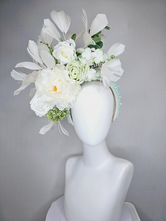 kentucky derby hat fascinator light blue pearl beaded headband, ivory white neutral flowers, green stems and leaves, ivory white feathers