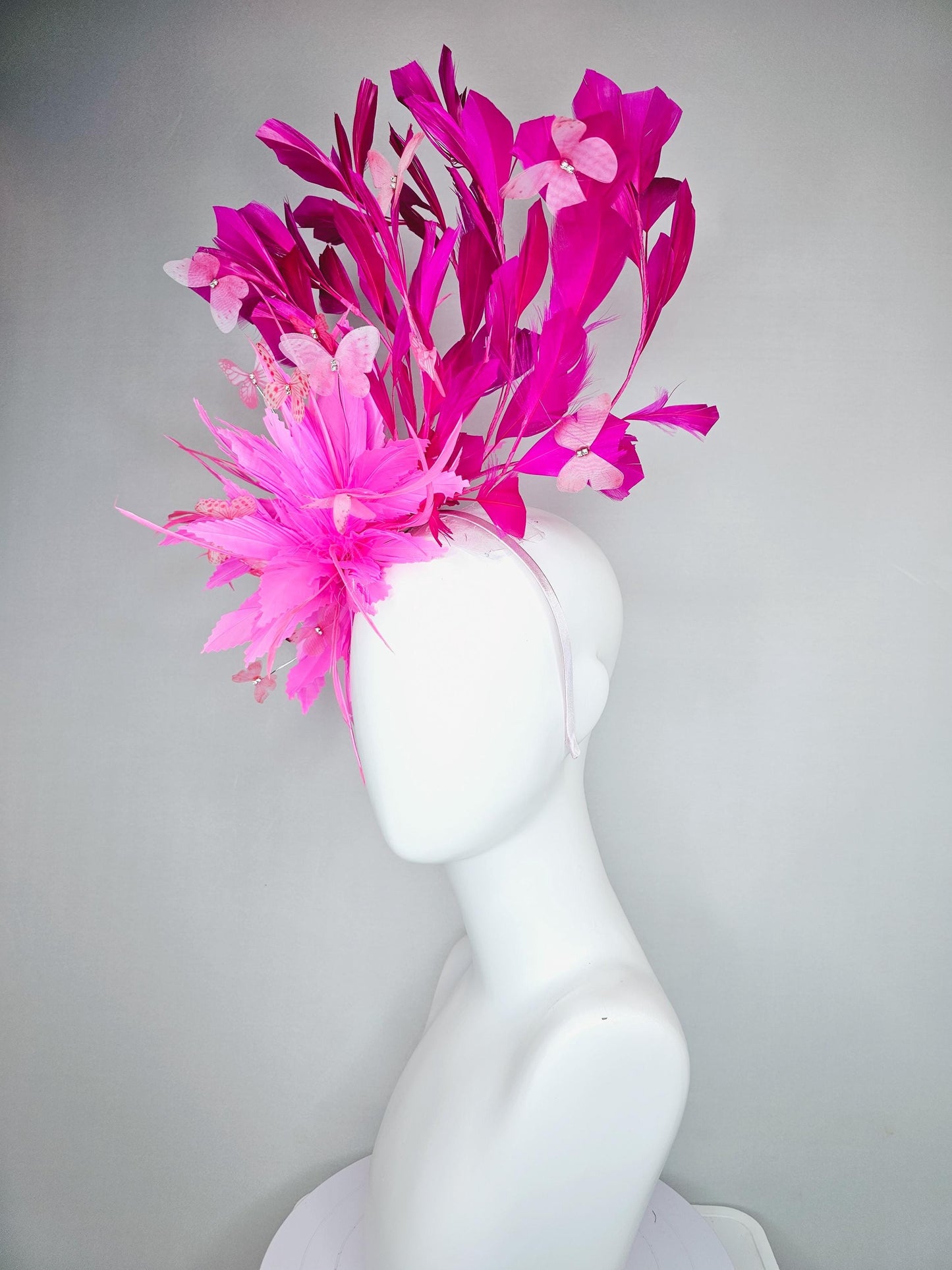 kentucky derby hat fascinator with fluffy pink zigzag feather, bright fuchsia pink branching feathers and pink butterflies