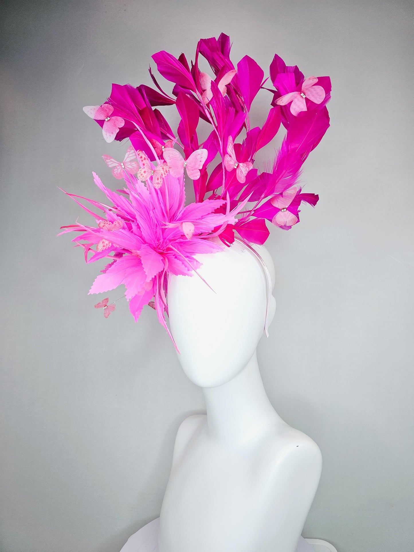 kentucky derby hat fascinator with fluffy pink zigzag feather, bright fuchsia pink branching feathers and pink butterflies