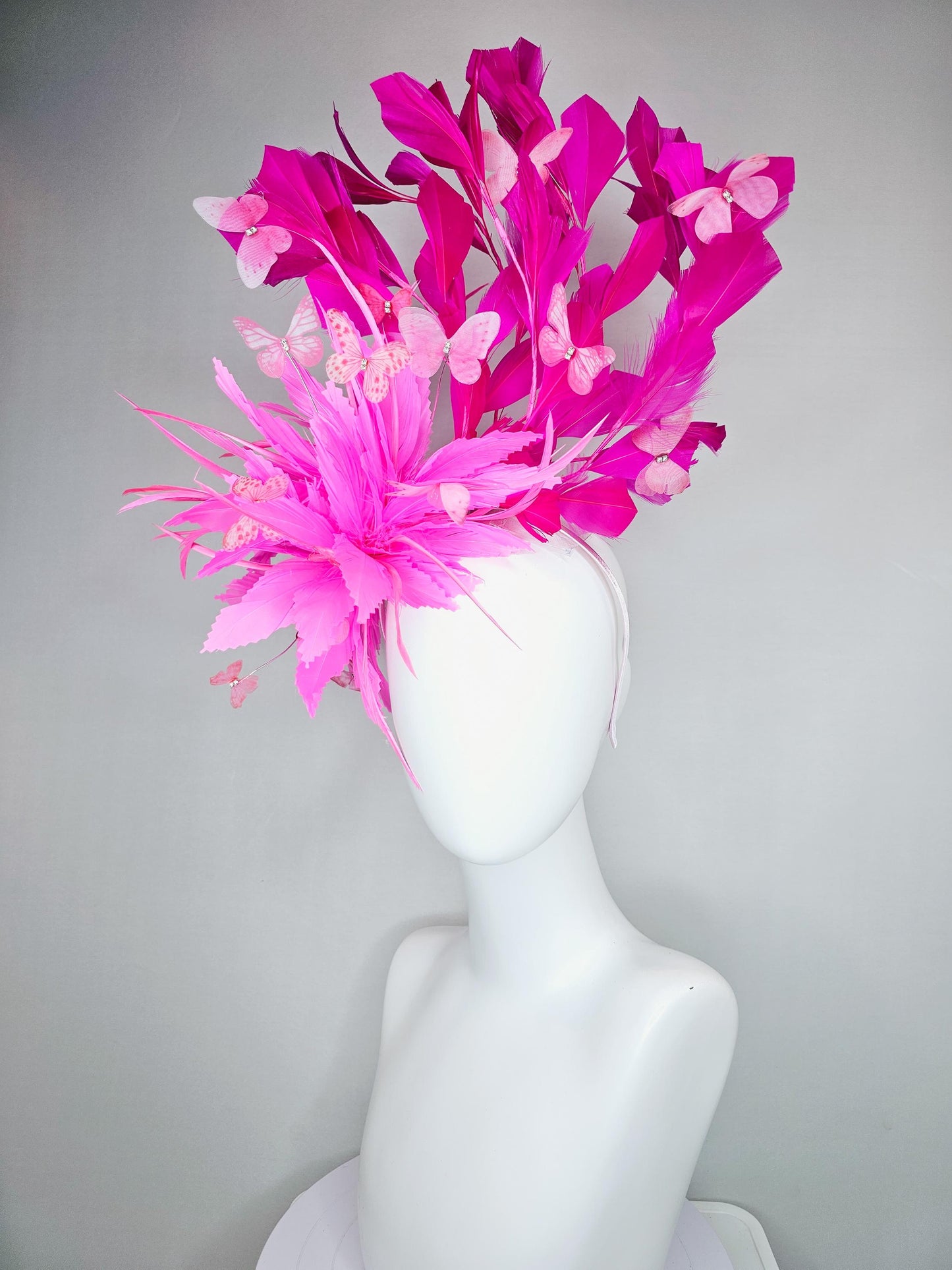 kentucky derby hat fascinator with fluffy pink zigzag feather, bright fuchsia pink branching feathers and pink butterflies