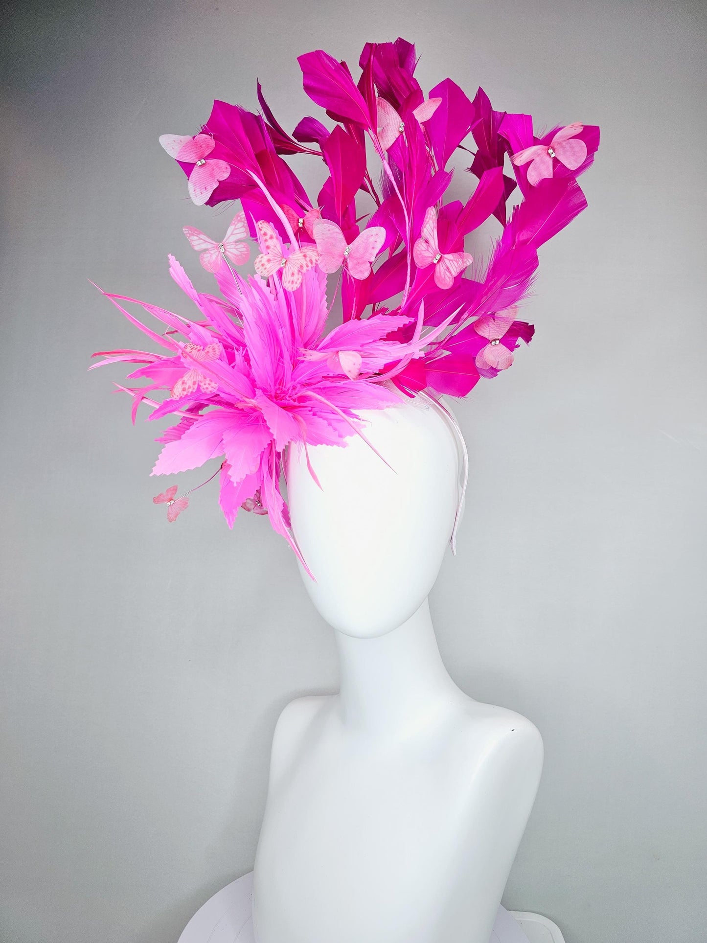 kentucky derby hat fascinator with fluffy pink zigzag feather, bright fuchsia pink branching feathers and pink butterflies