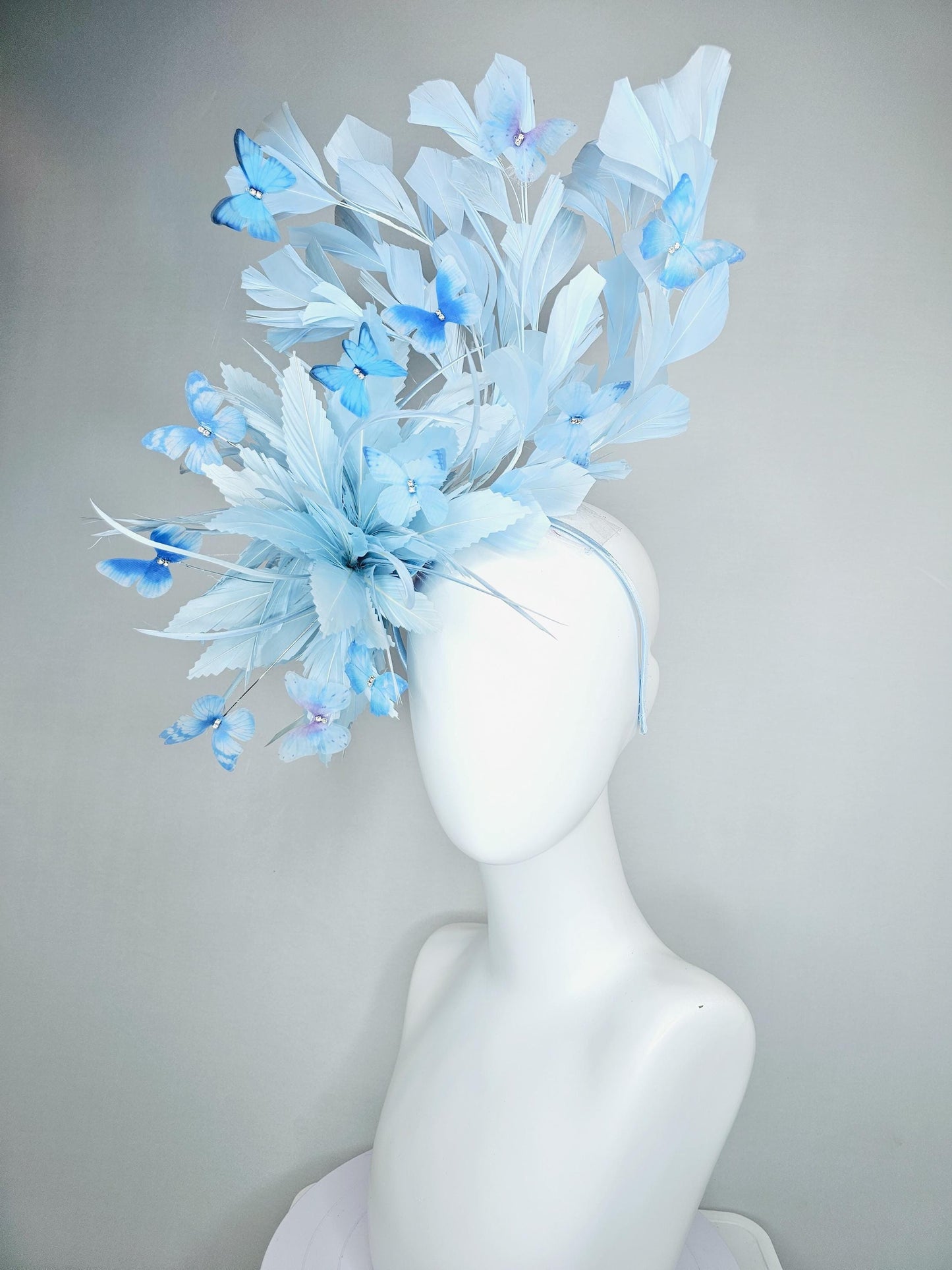 kentucky derby hat fascinator with fluffy light baby blue zigzag feathers, light baby blue branching feathers, light sky blue butterflies