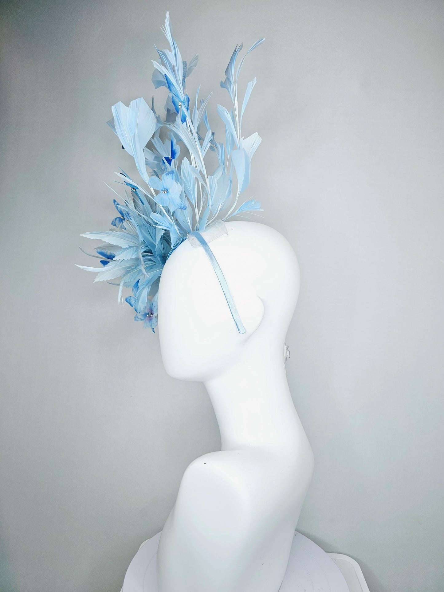 kentucky derby hat fascinator with fluffy light baby blue zigzag feathers, light baby blue branching feathers, light sky blue butterflies