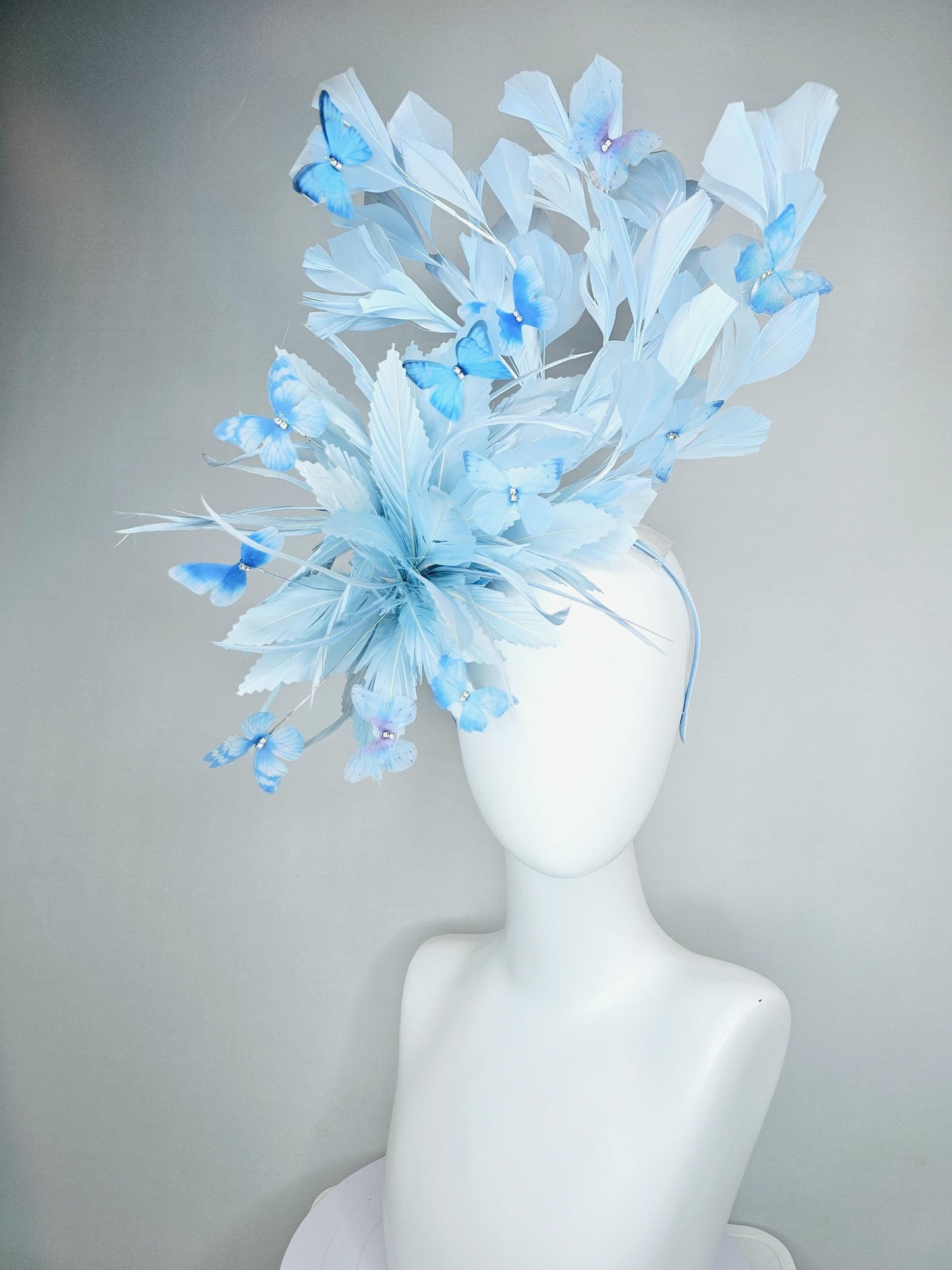 kentucky derby hat fascinator with fluffy light baby blue zigzag feathers, light baby blue branching feathers, light sky blue butterflies