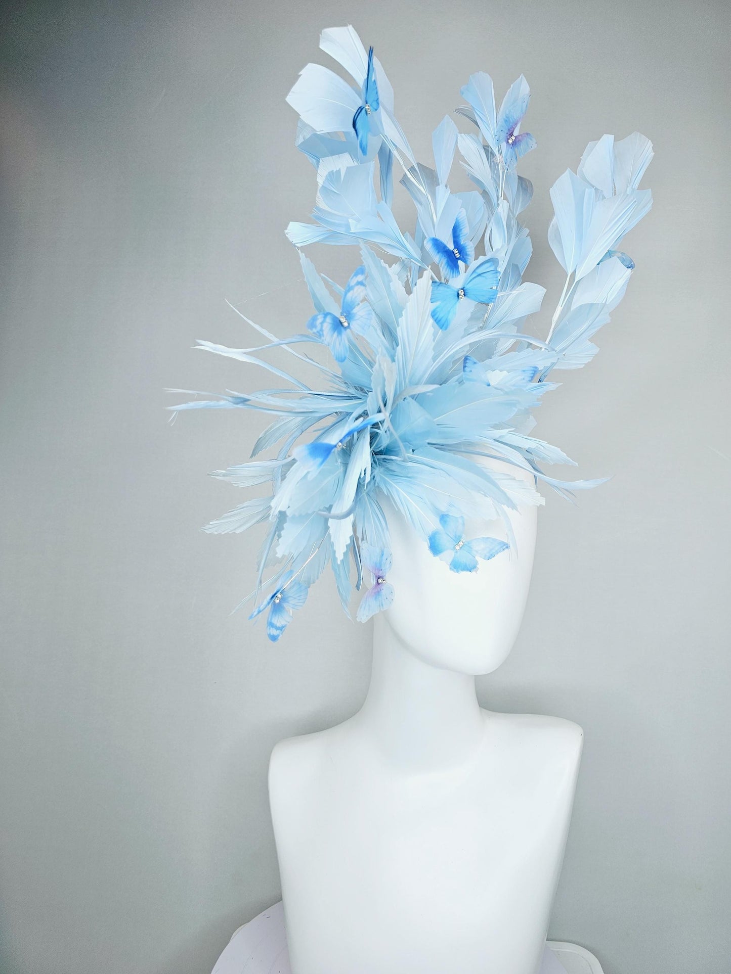 kentucky derby hat fascinator with fluffy light baby blue zigzag feathers, light baby blue branching feathers, light sky blue butterflies