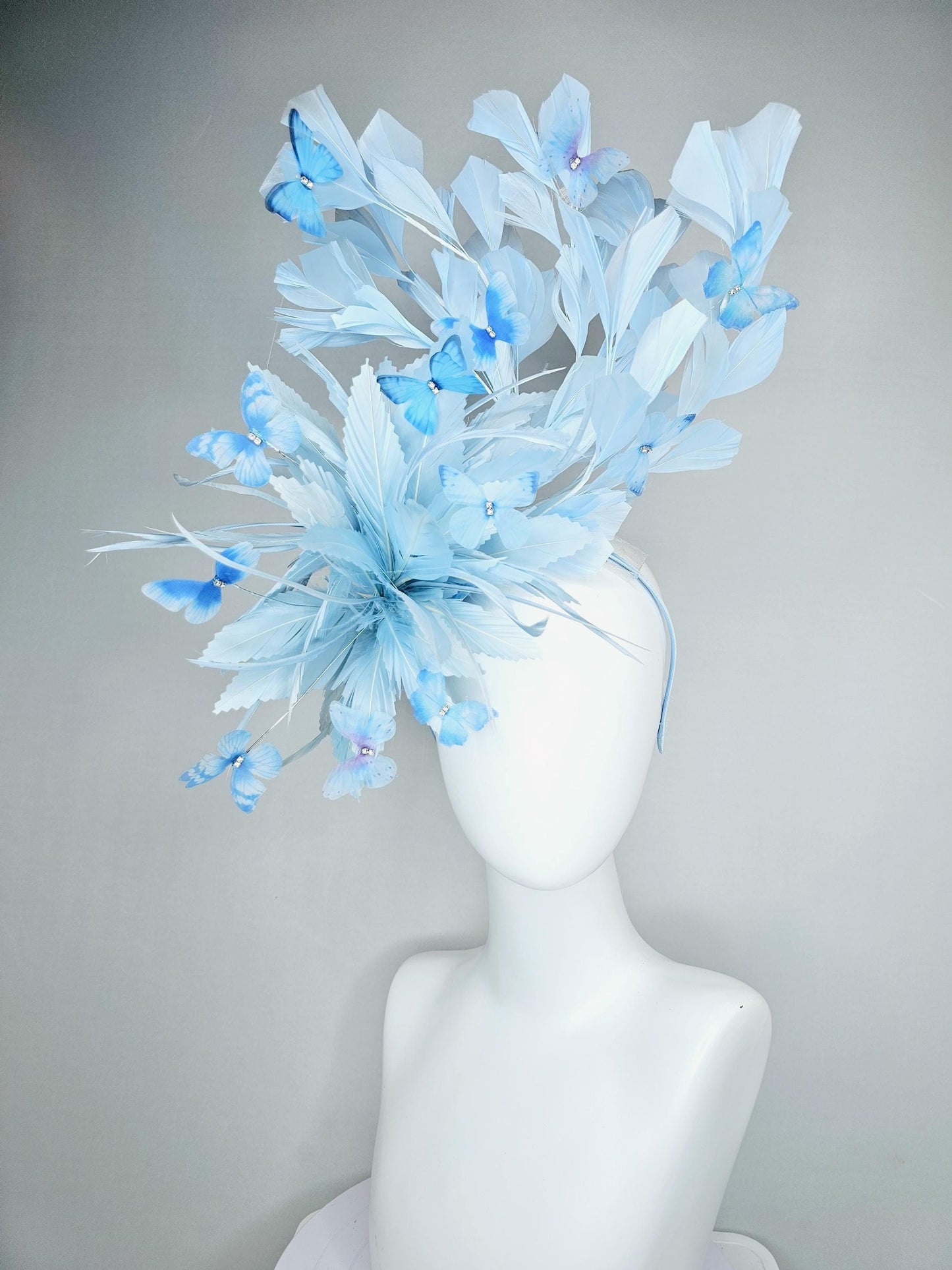 kentucky derby hat fascinator with fluffy light baby blue zigzag feathers, light baby blue branching feathers, light sky blue butterflies