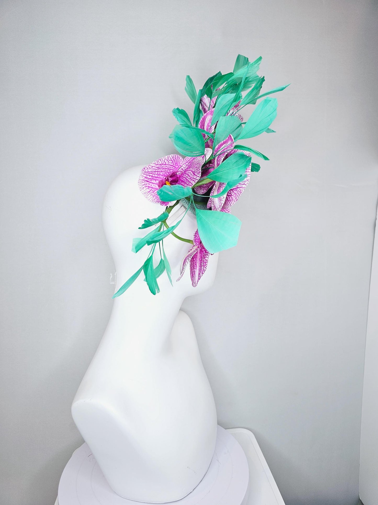 kentucky derby hat fascinator white and purple orchid satin silk flowers, bright mint green branching feathers