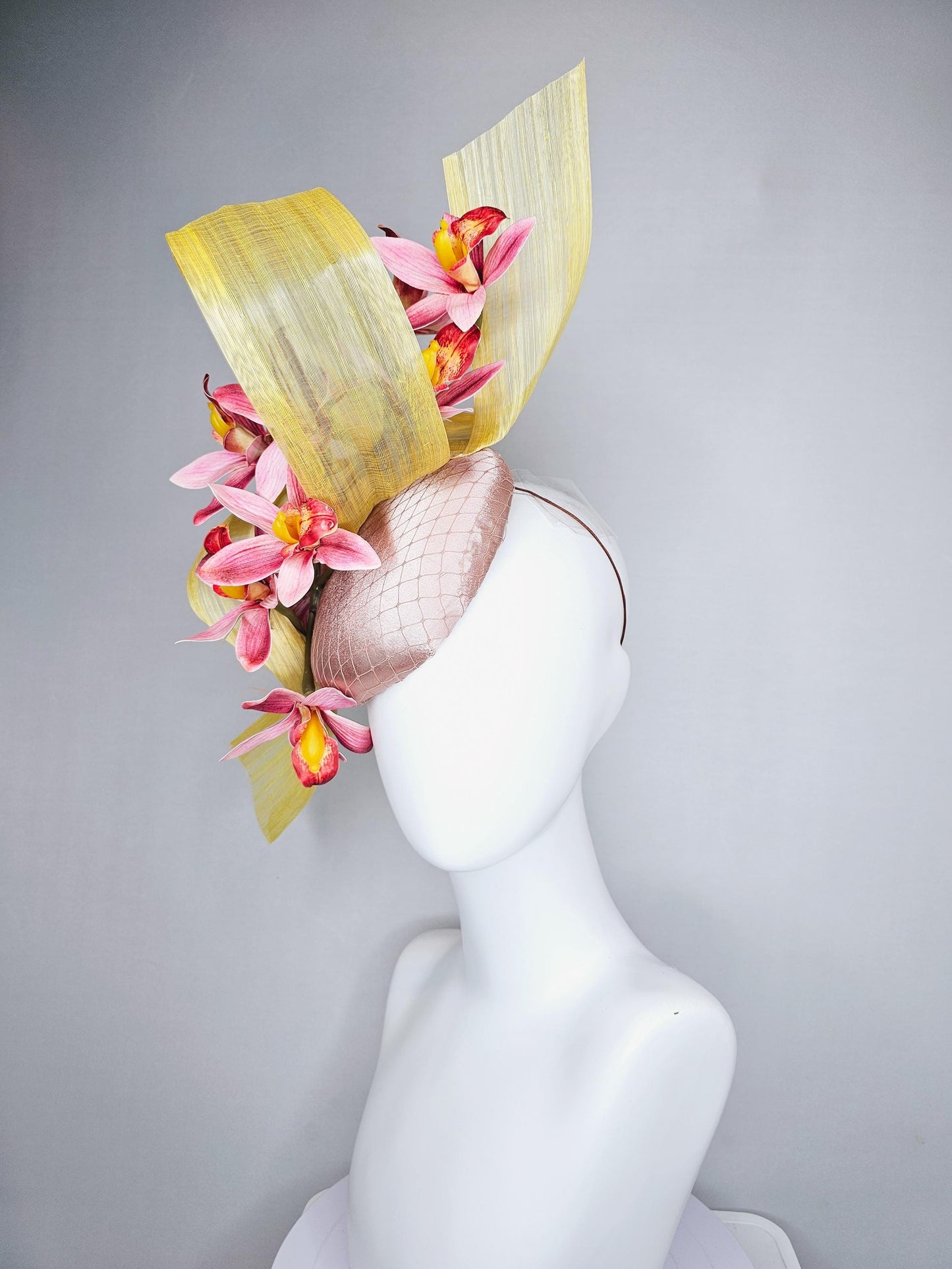 kentucky derby hat fascinator light pink satin with netting, ombre red and yellow orchid flowers, yellow silk ribbon large bendable decor