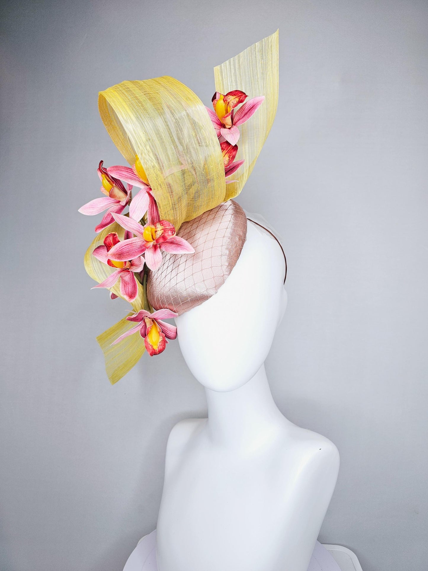 kentucky derby hat fascinator light pink satin with netting, ombre red and yellow orchid flowers, yellow silk ribbon large bendable decor