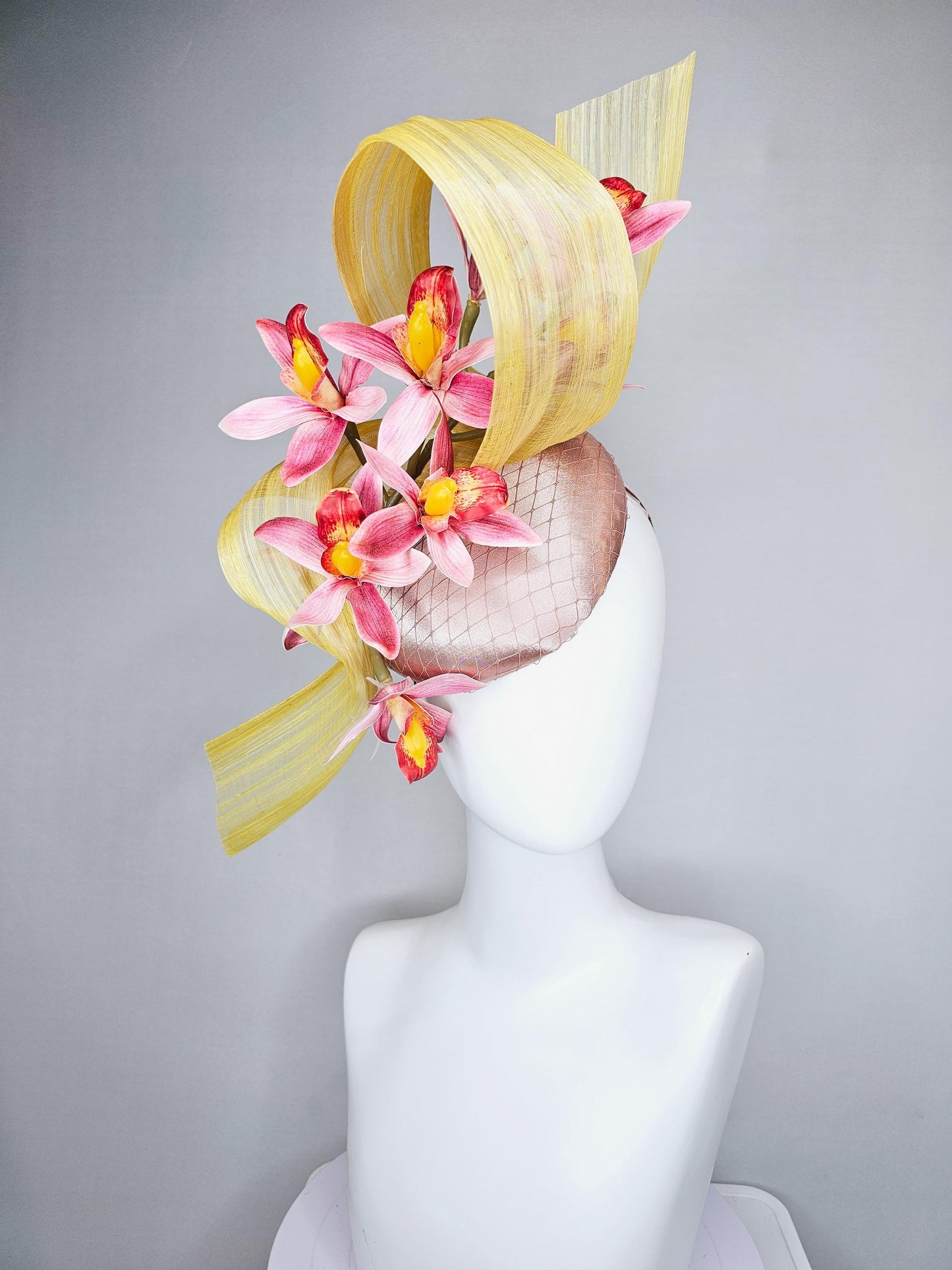 kentucky derby hat fascinator light pink satin with netting, ombre red and yellow orchid flowers, yellow silk ribbon large bendable decor