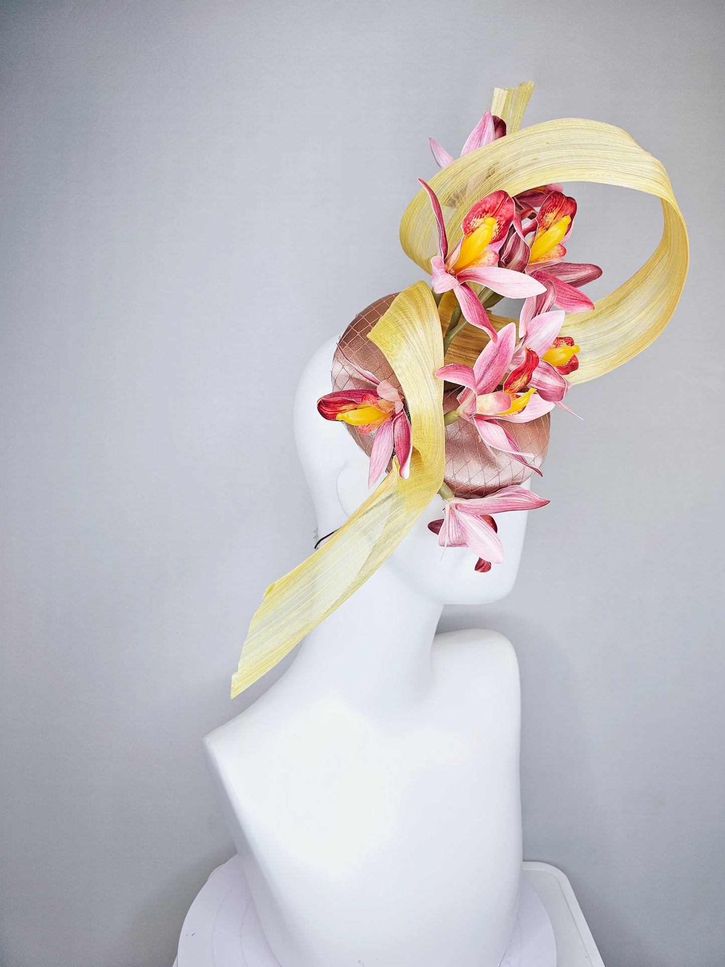 kentucky derby hat fascinator light pink satin with netting, ombre red and yellow orchid flowers, yellow silk ribbon large bendable decor