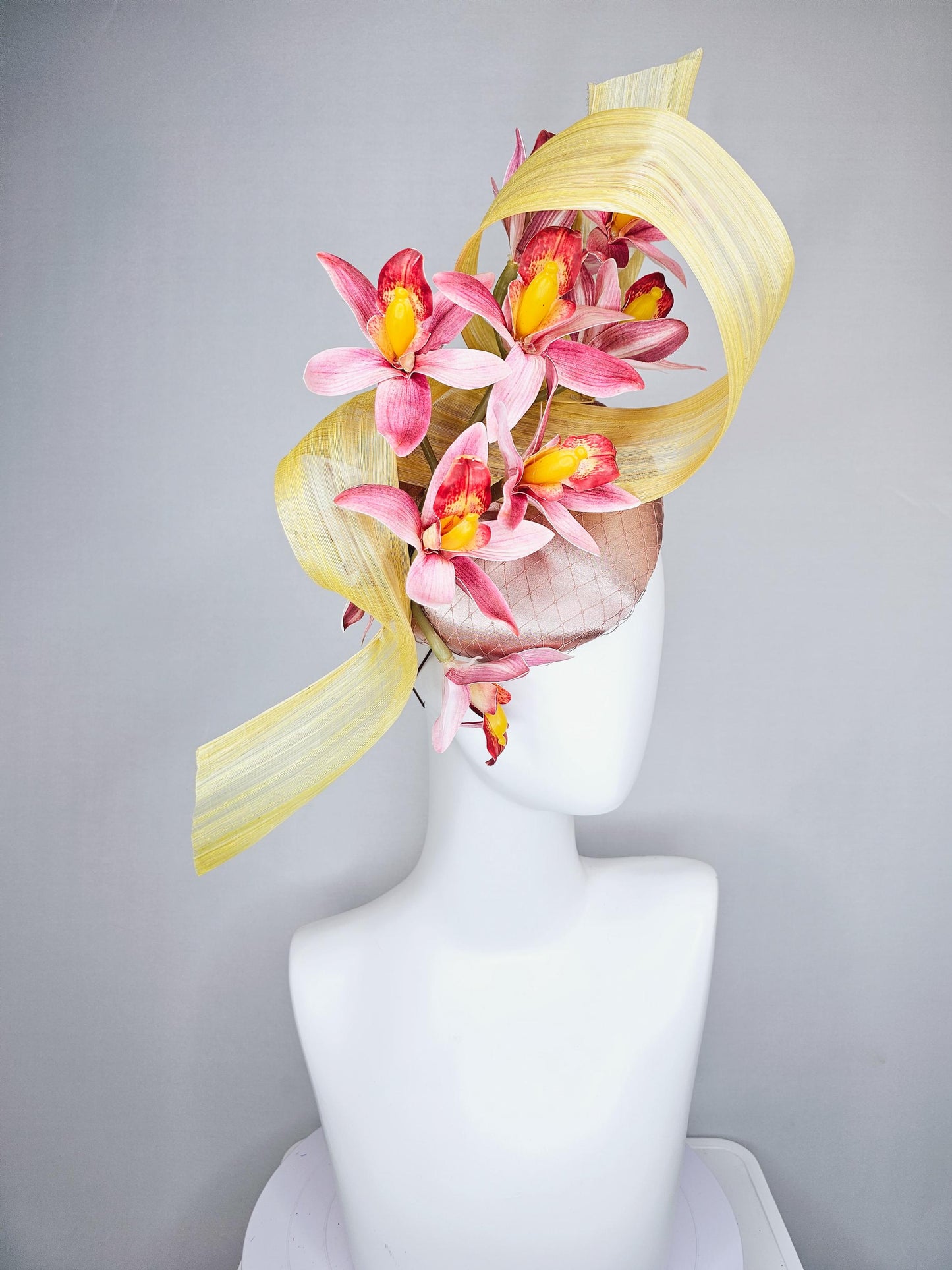 kentucky derby hat fascinator light pink satin with netting, ombre red and yellow orchid flowers, yellow silk ribbon large bendable decor