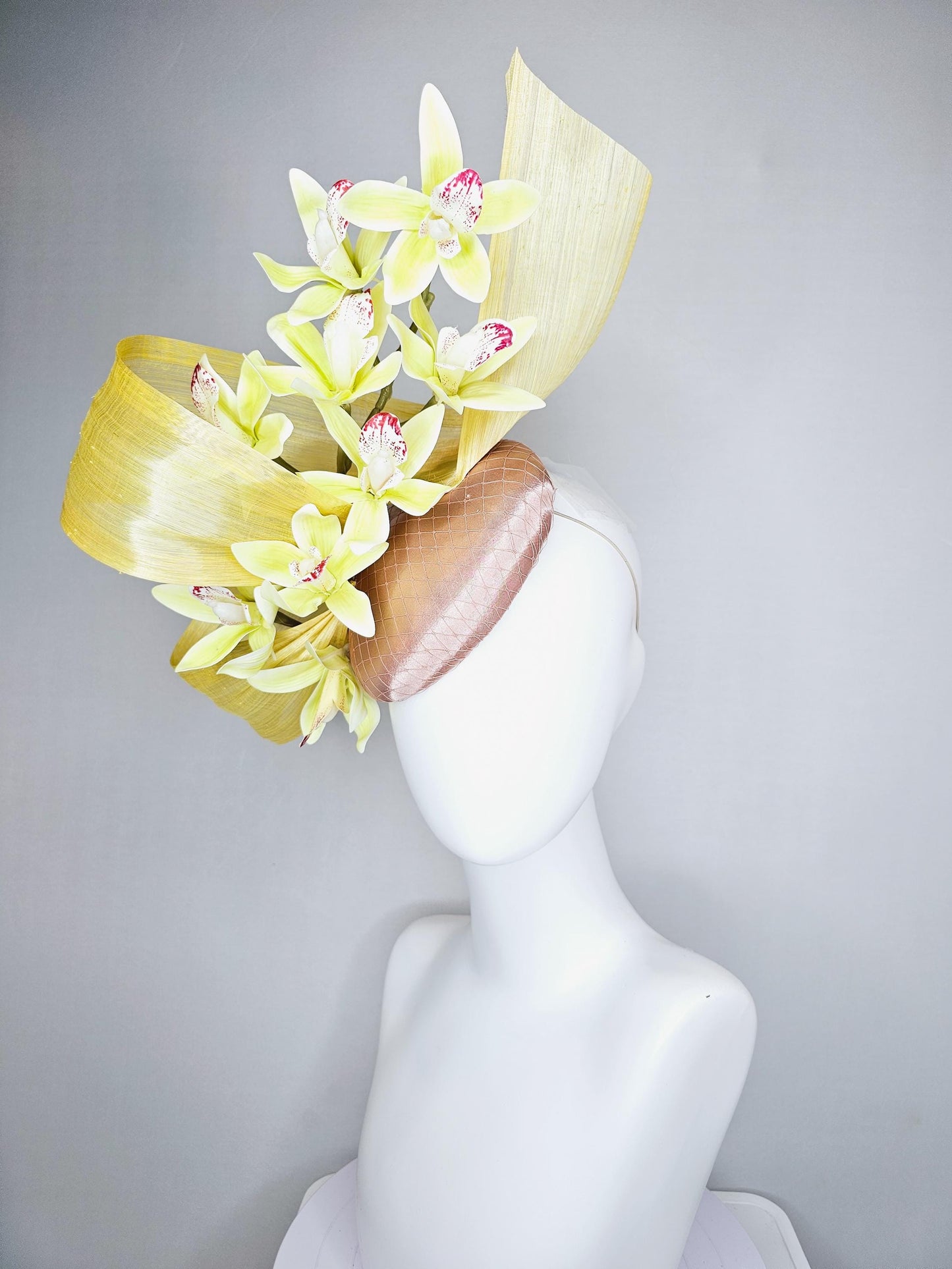 kentucky derby hat fascinator light pink satin with netting, yellow and wine red orchid flowers, yellow silk ribbon large bendable decor