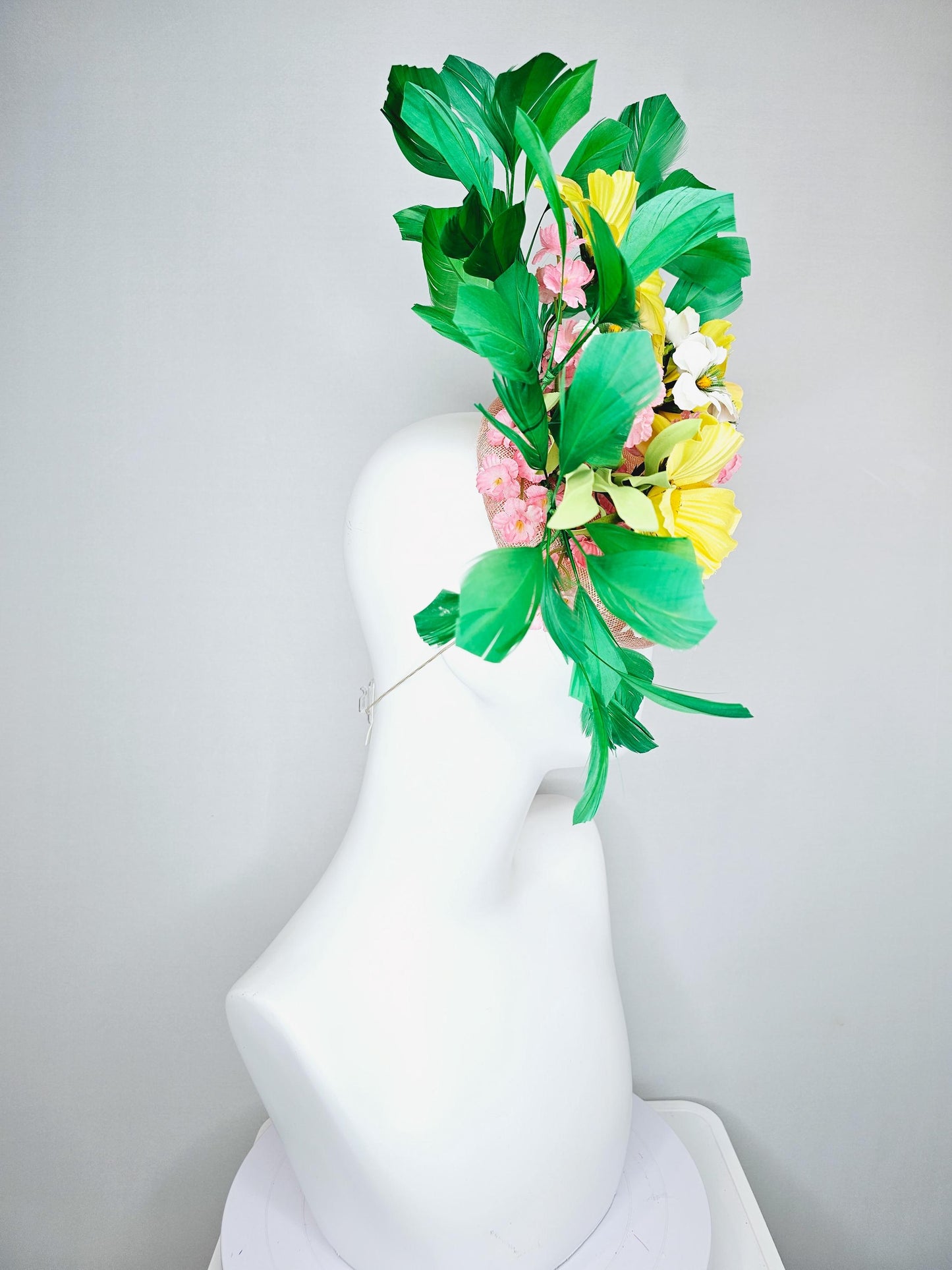 kentucky derby hat fascinator light pink sinamay with yellow white blush pink satin flowers, green leaves, emerald green branching feathers