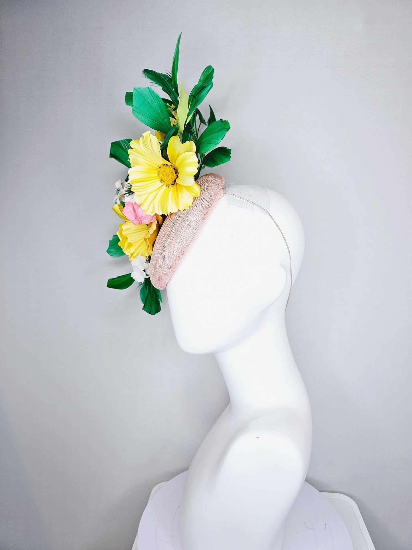 kentucky derby hat fascinator light pink sinamay with yellow white blush pink satin flowers, green leaves, emerald green branching feathers