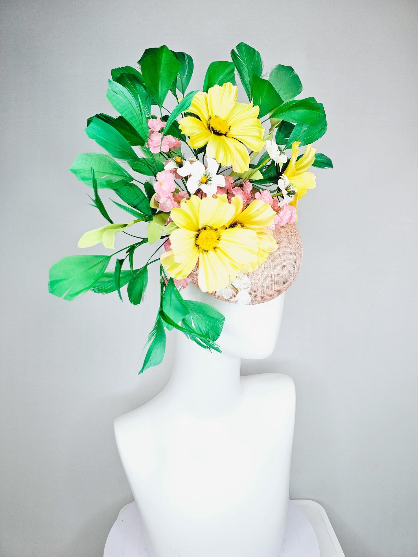 kentucky derby hat fascinator light pink sinamay with yellow white blush pink satin flowers, green leaves, emerald green branching feathers