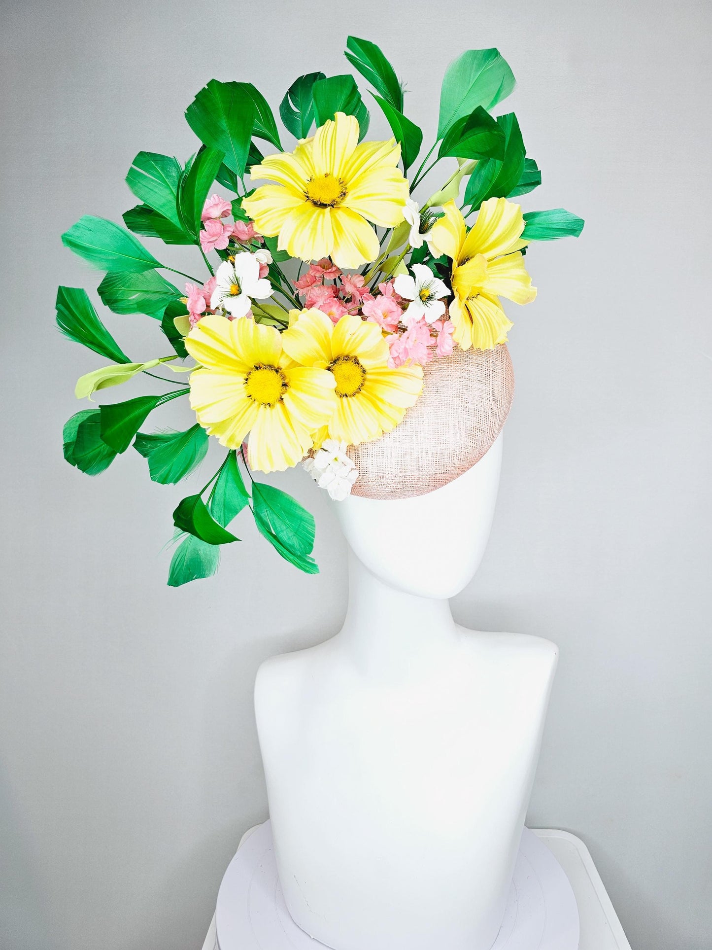 kentucky derby hat fascinator light pink sinamay with yellow white blush pink satin flowers, green leaves, emerald green branching feathers