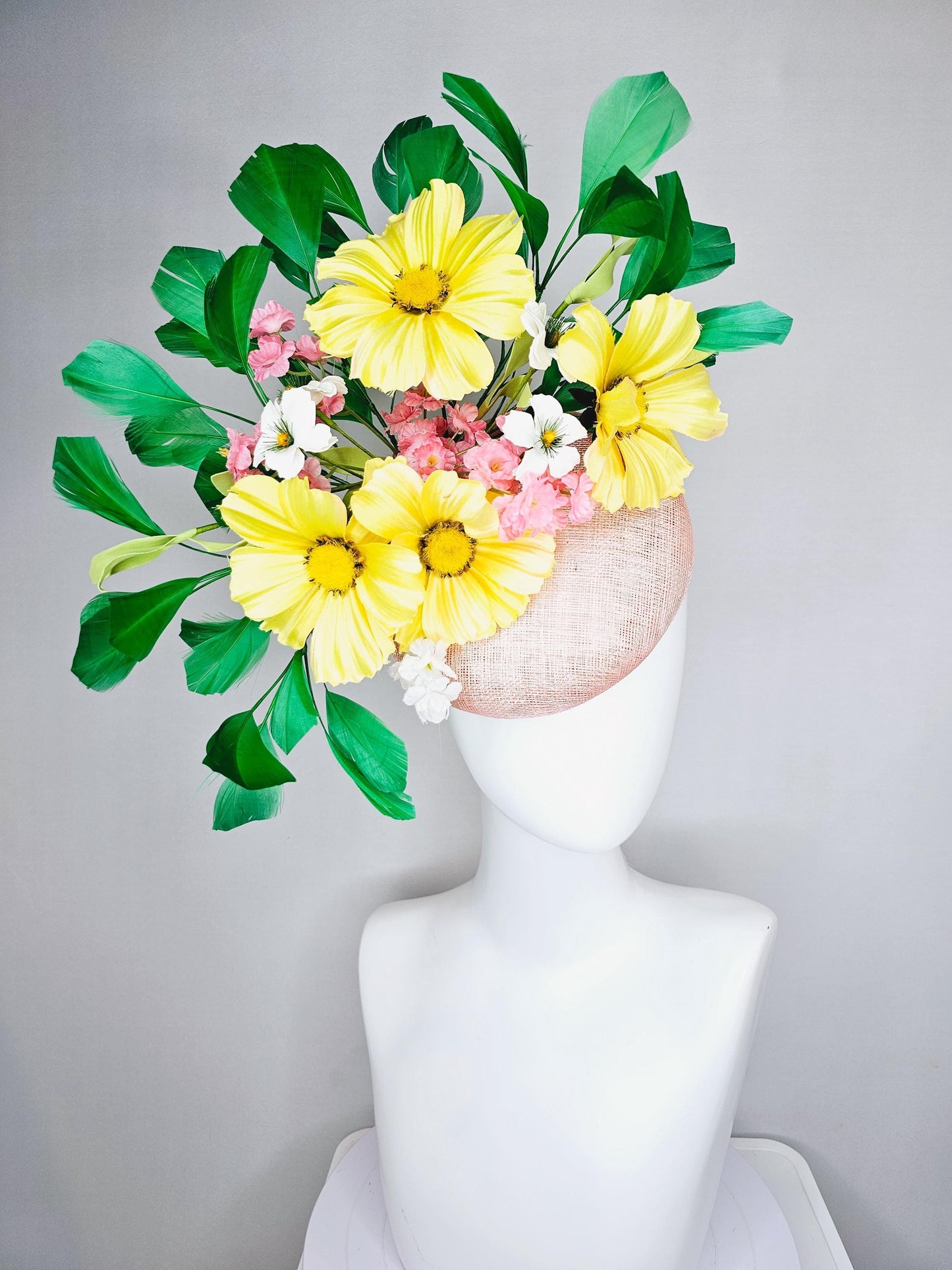 kentucky derby hat fascinator light pink sinamay with yellow white blush pink satin flowers, green leaves, emerald green branching feathers