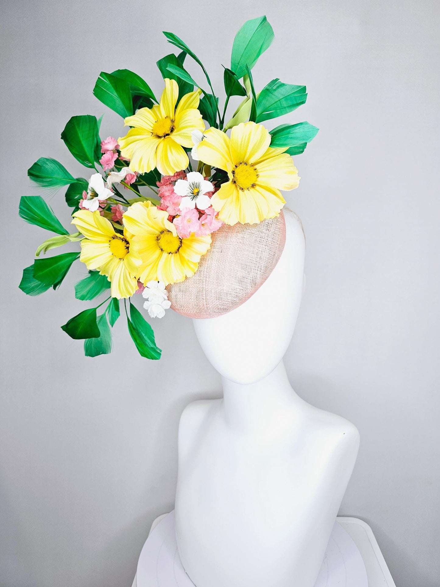 kentucky derby hat fascinator light pink sinamay with yellow white blush pink satin flowers, green leaves, emerald green branching feathers