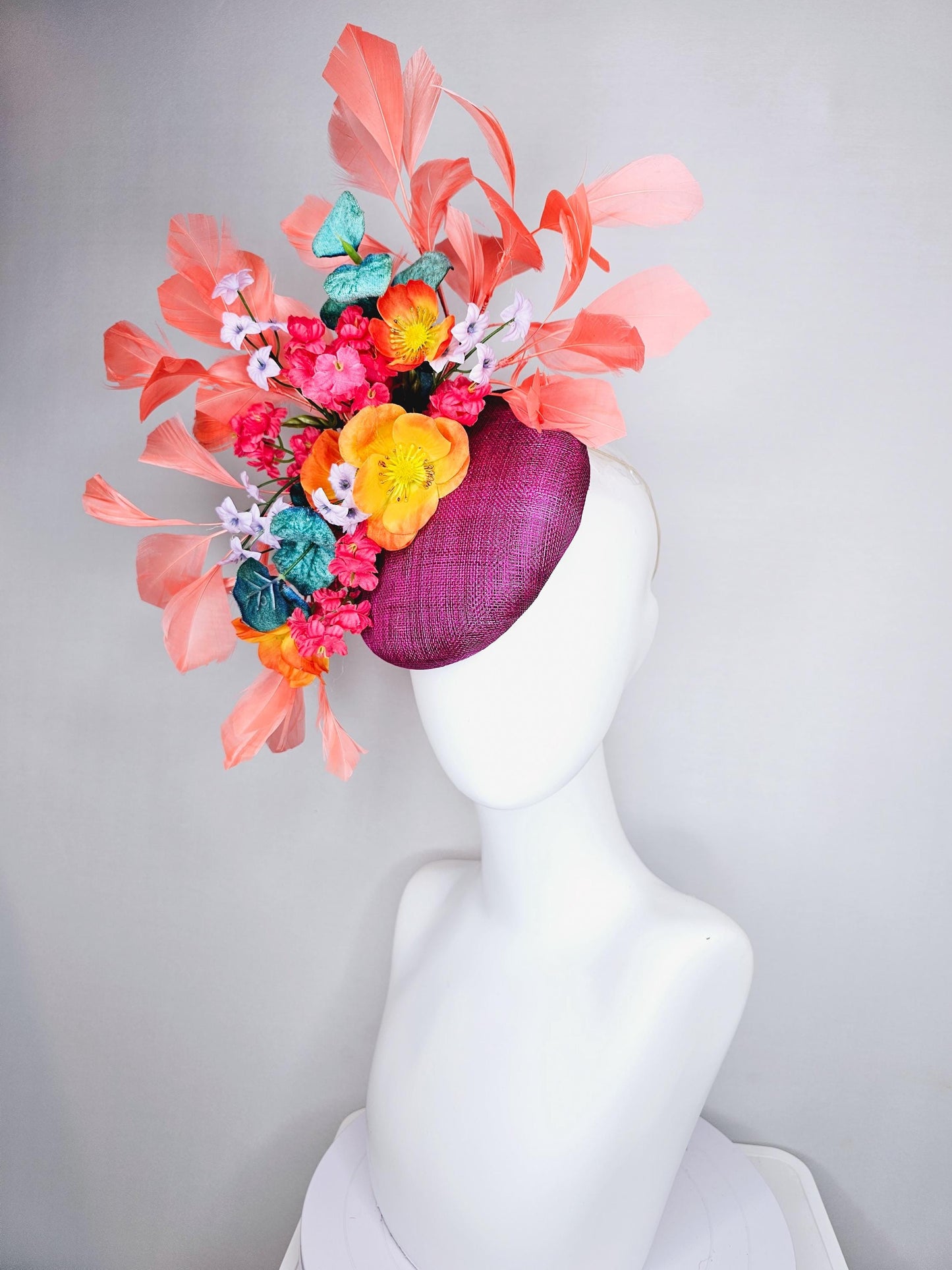 kentucky derby hat fascinator magenta purple sinamay, orange cherry red white satin flowers,teal blue leaves,coral orange branching feathers