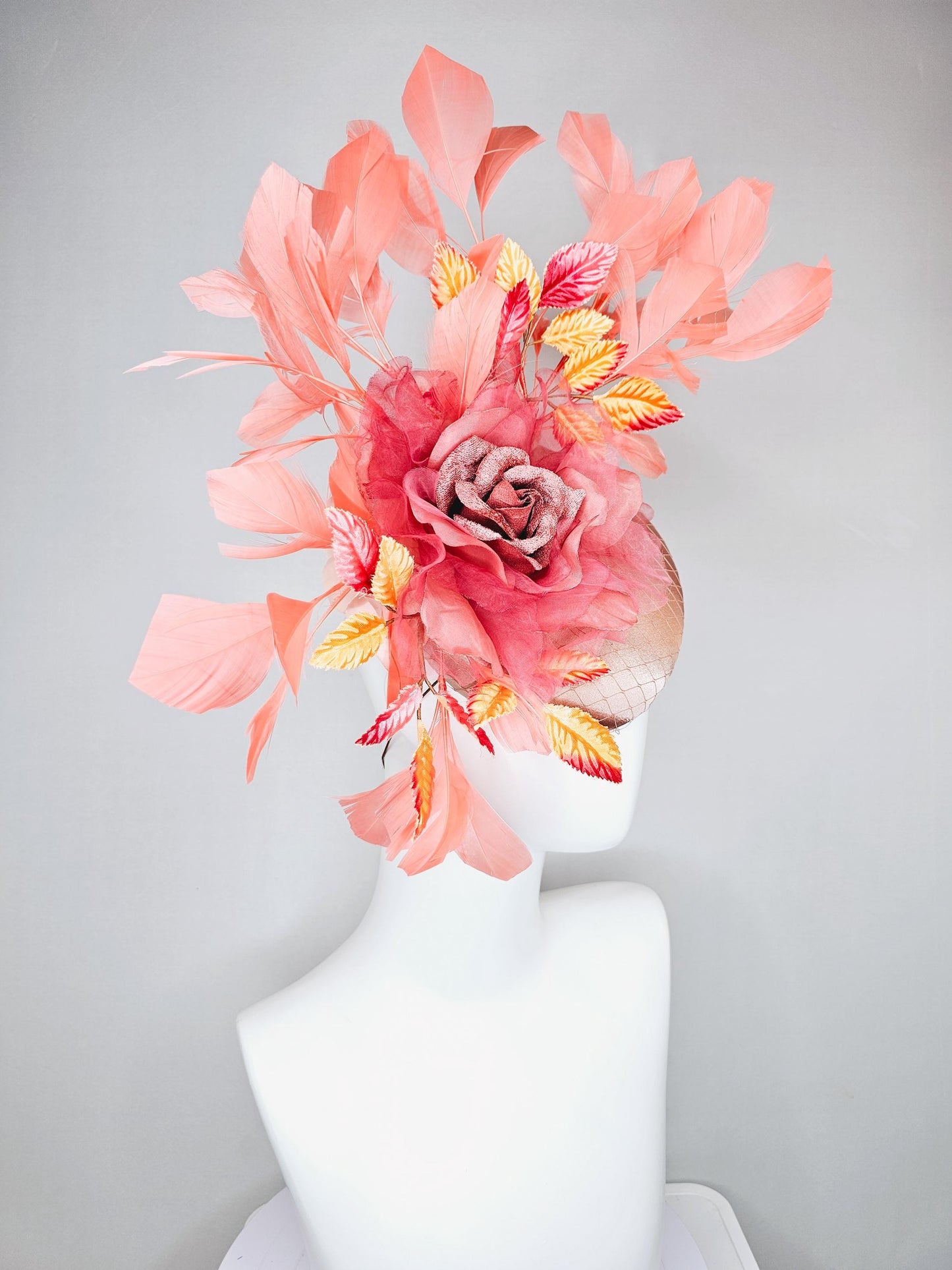 kentucky derby hat fascinator light pink satin w/ netting, dusty pink organza flower,yellow and pink leaves, peach orange branching feathers