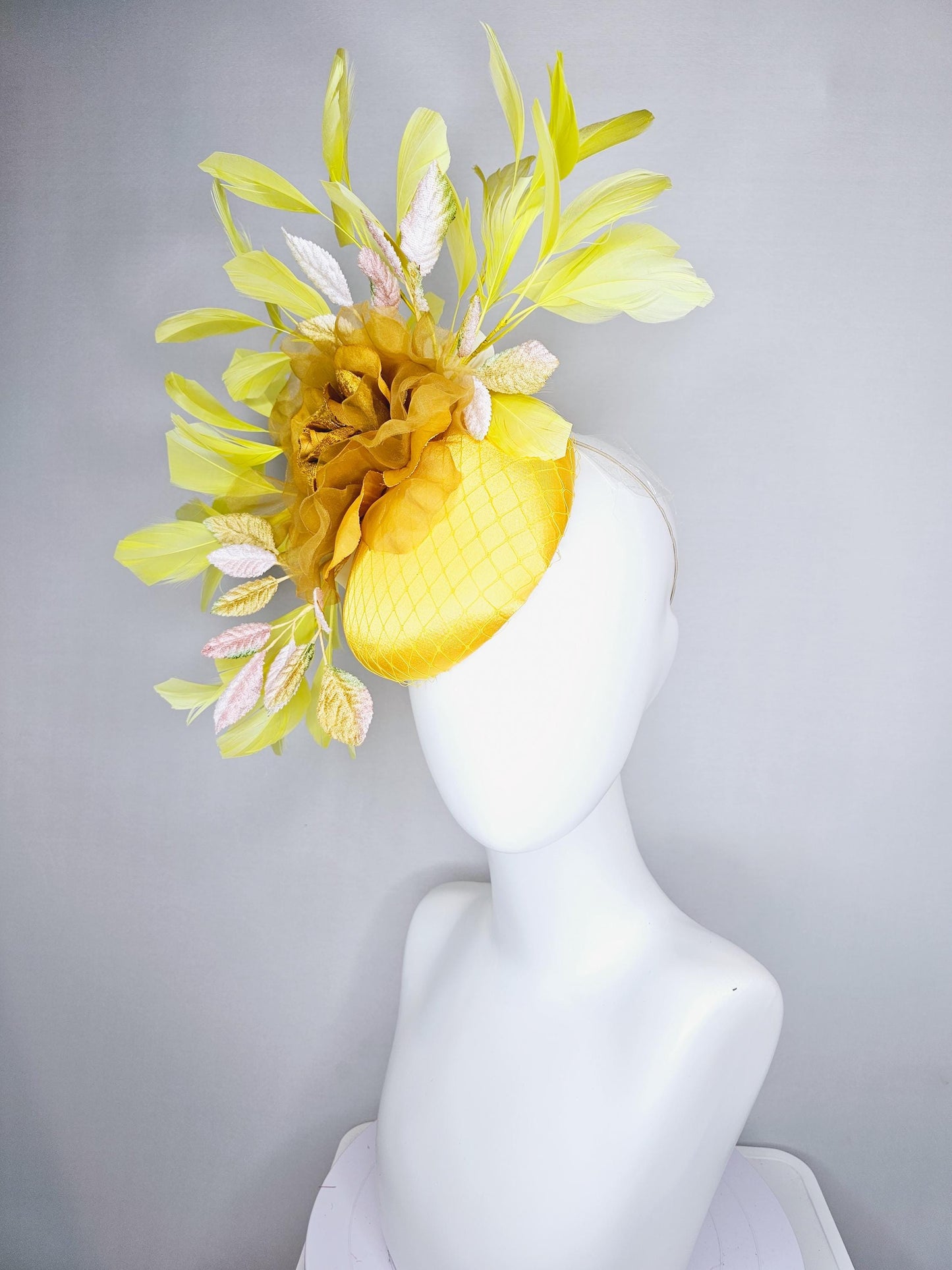 kentucky derby hat fascinator yellow satin with netting, mustard yellow organza flower, light pink yellow leaves, yellow branching feathers