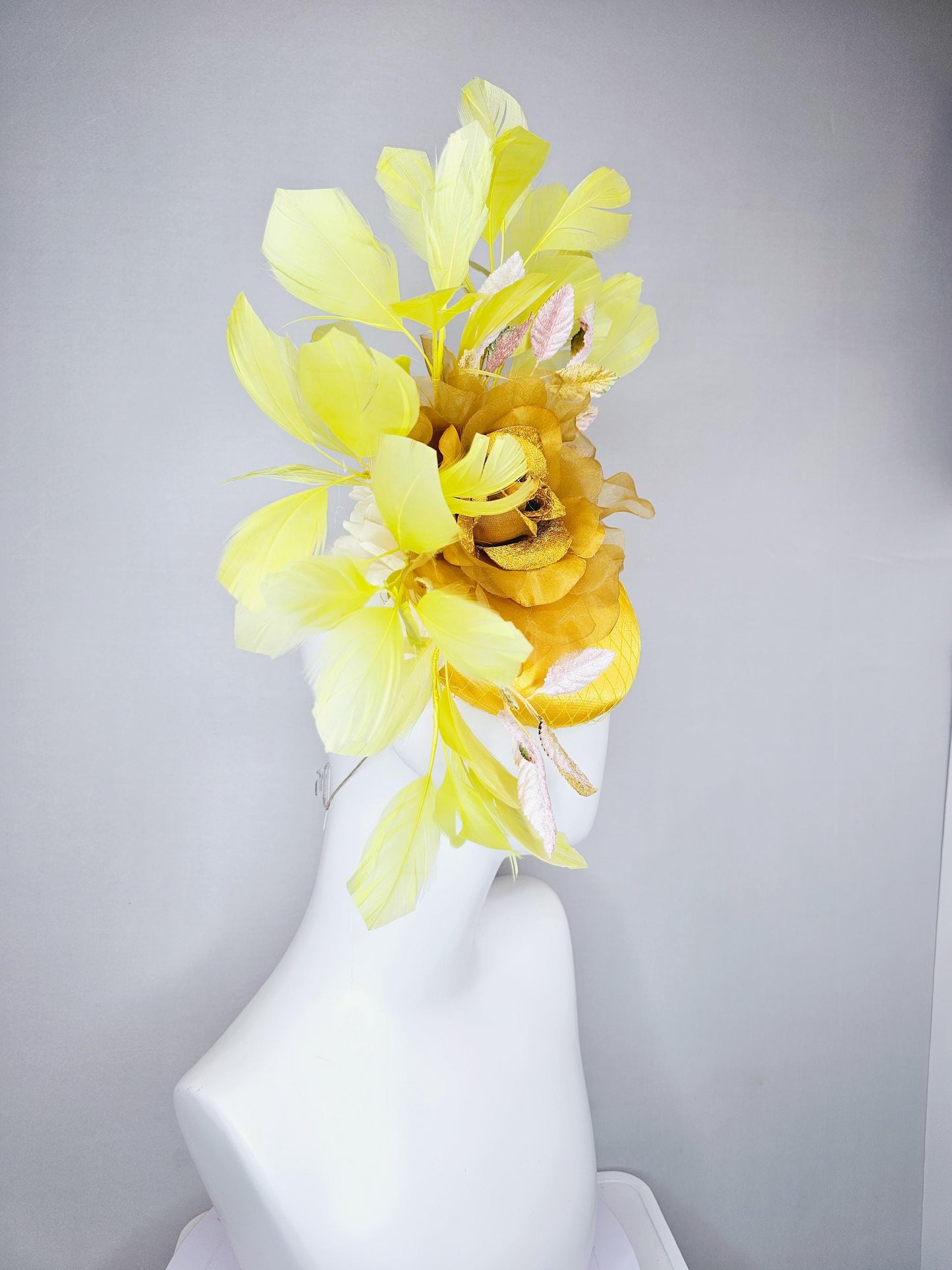 kentucky derby hat fascinator yellow satin with netting, mustard yellow organza flower, light pink yellow leaves, yellow branching feathers