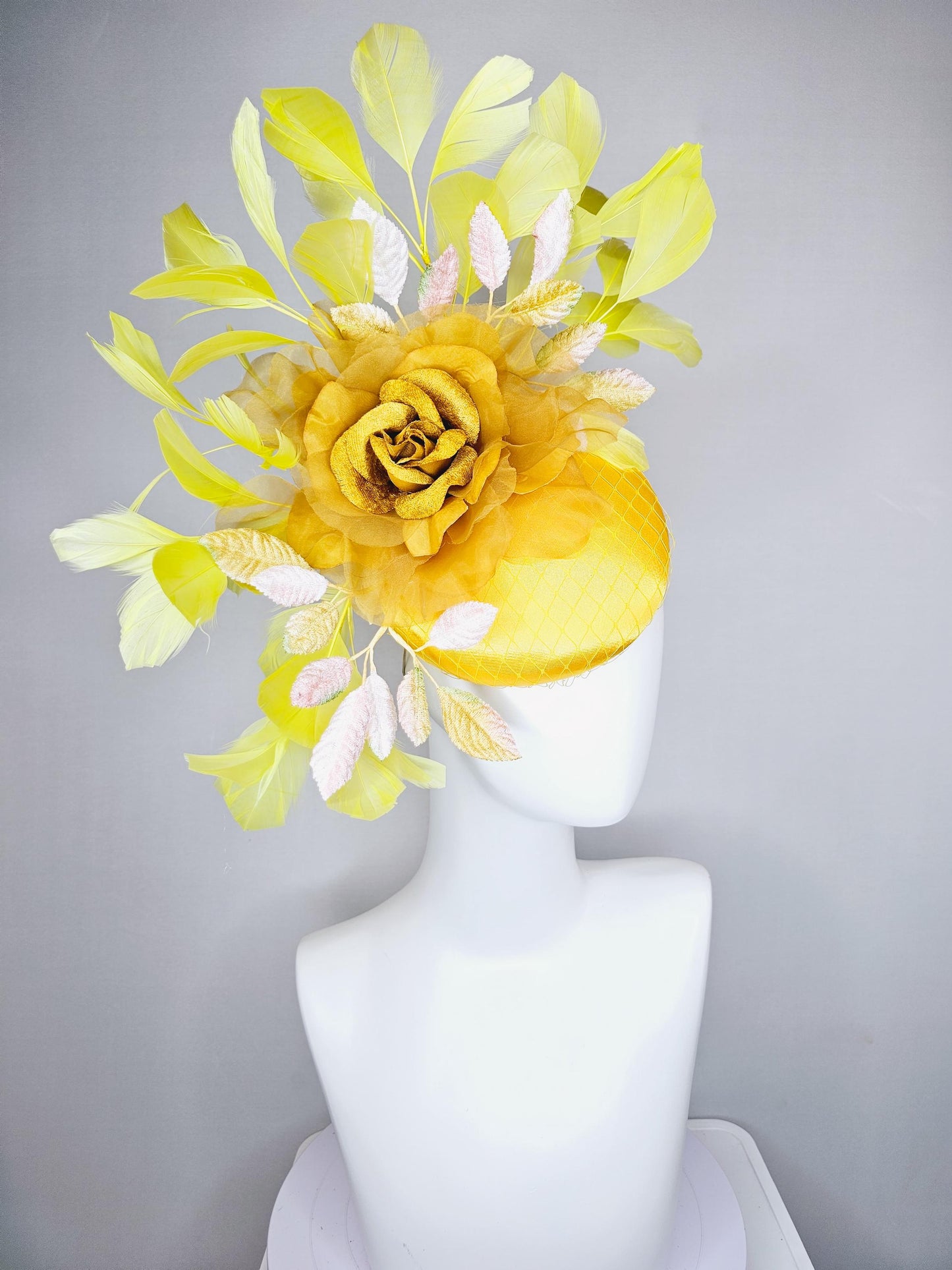 kentucky derby hat fascinator yellow satin with netting, mustard yellow organza flower, light pink yellow leaves, yellow branching feathers