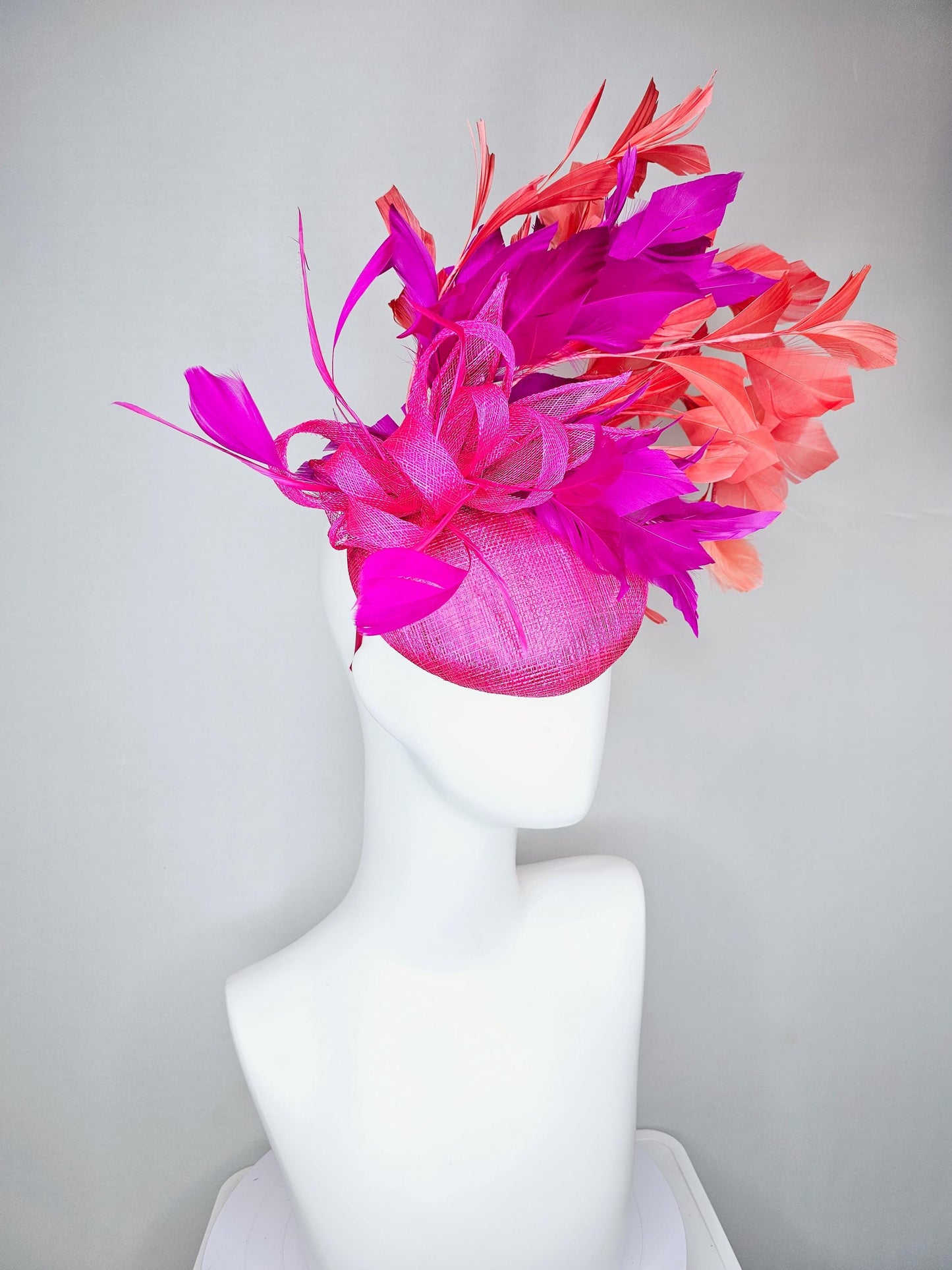 kentucky derby hat fascinator hot bright pink sinamay base with bright pink sinamay bow flower, pink fuchsia coral orange branching feathers