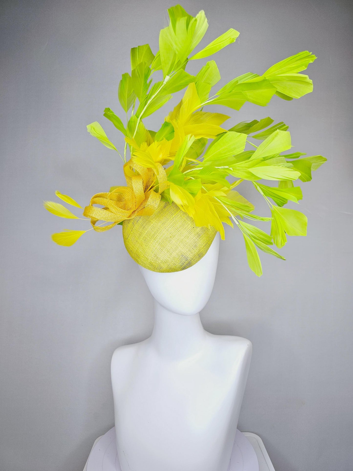 kentucky derby hat fascinator yellow sinamay base with yellow sinamay bow, yellow and yellow lime green branching feathers