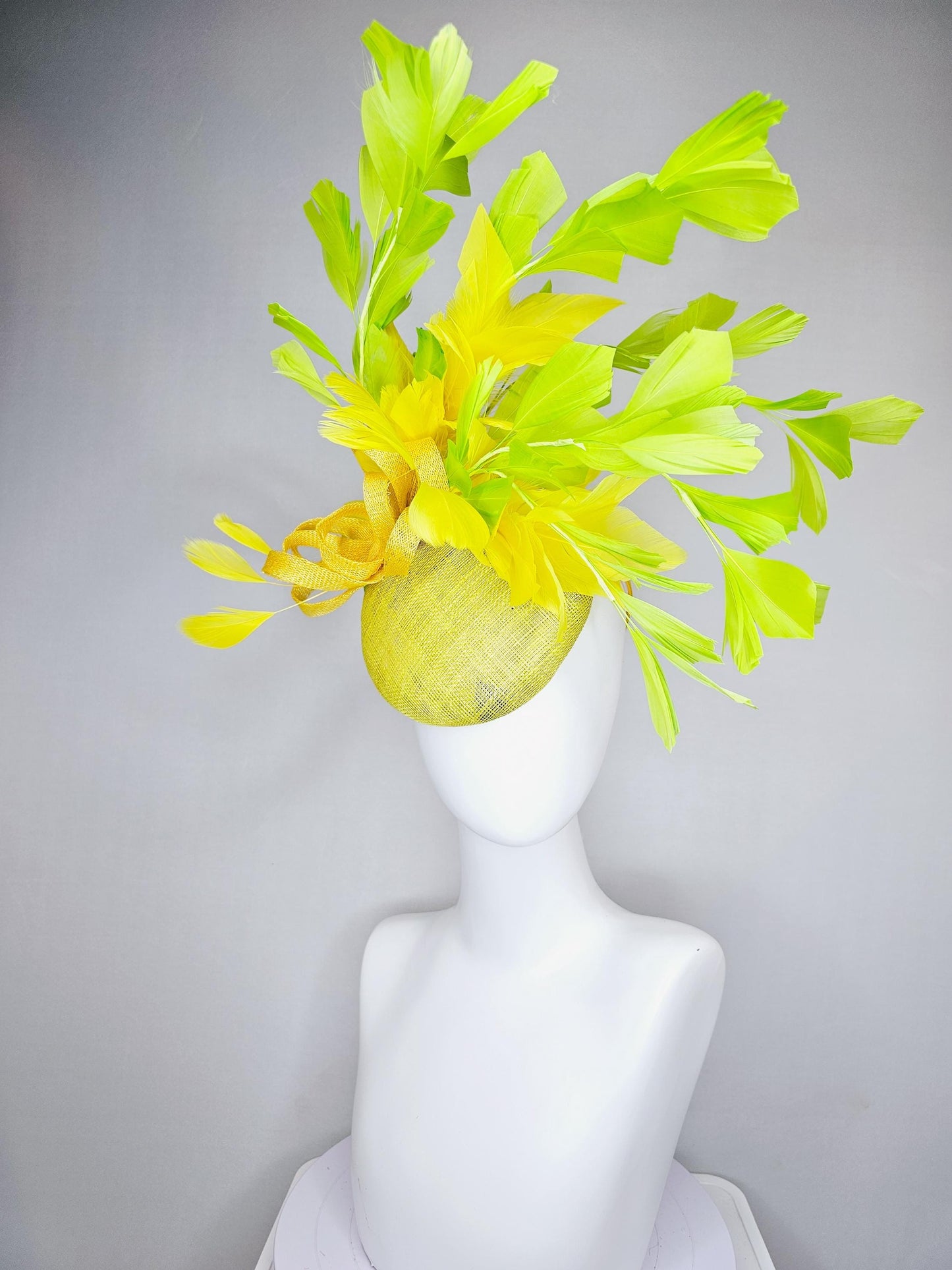 kentucky derby hat fascinator yellow sinamay base with yellow sinamay bow, yellow and yellow lime green branching feathers