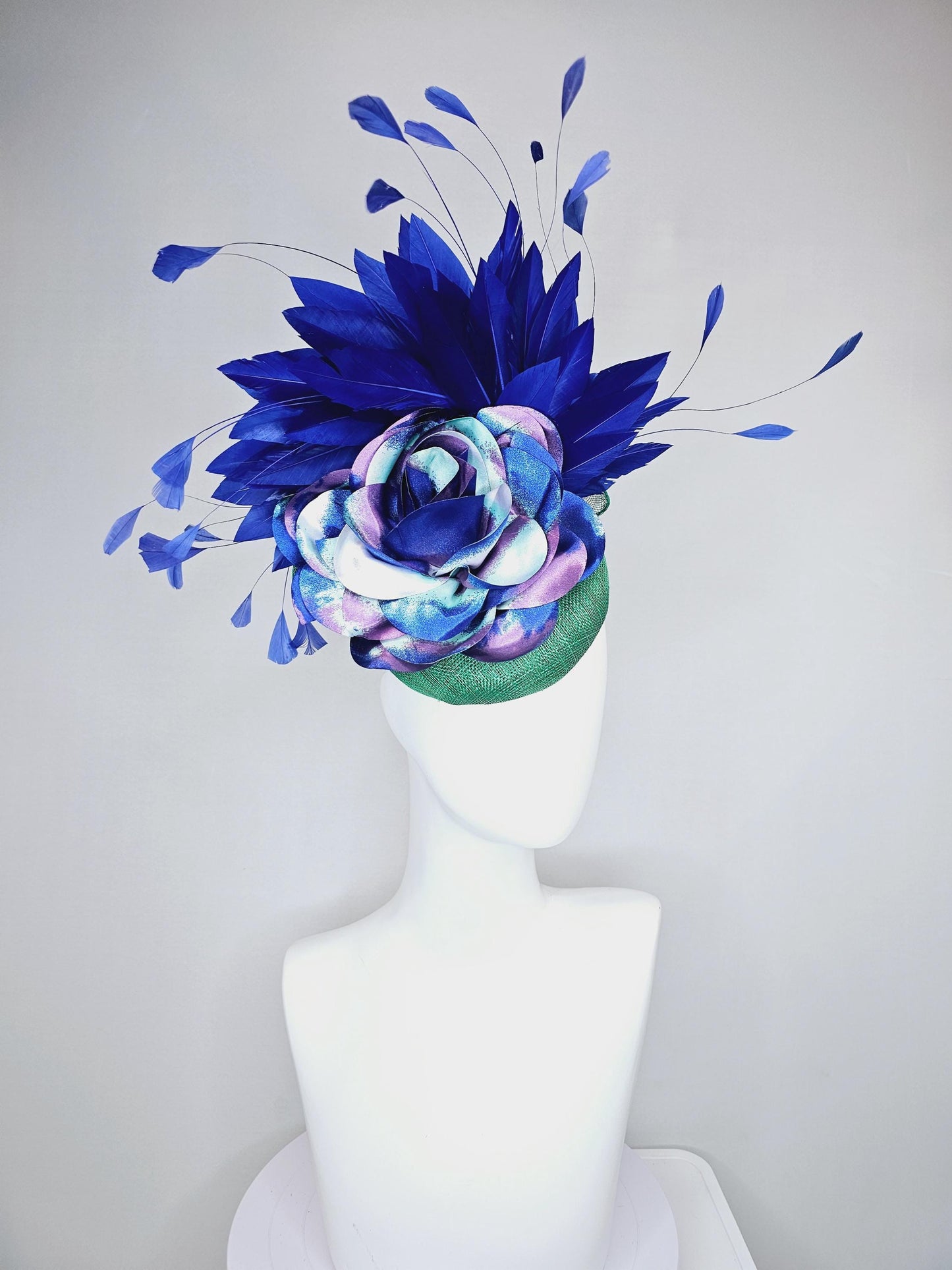 kentucky derby hat fascinator green sinamay, cobalt blue branching feathers and large blue,turquoise and purple ombre satin rose flower