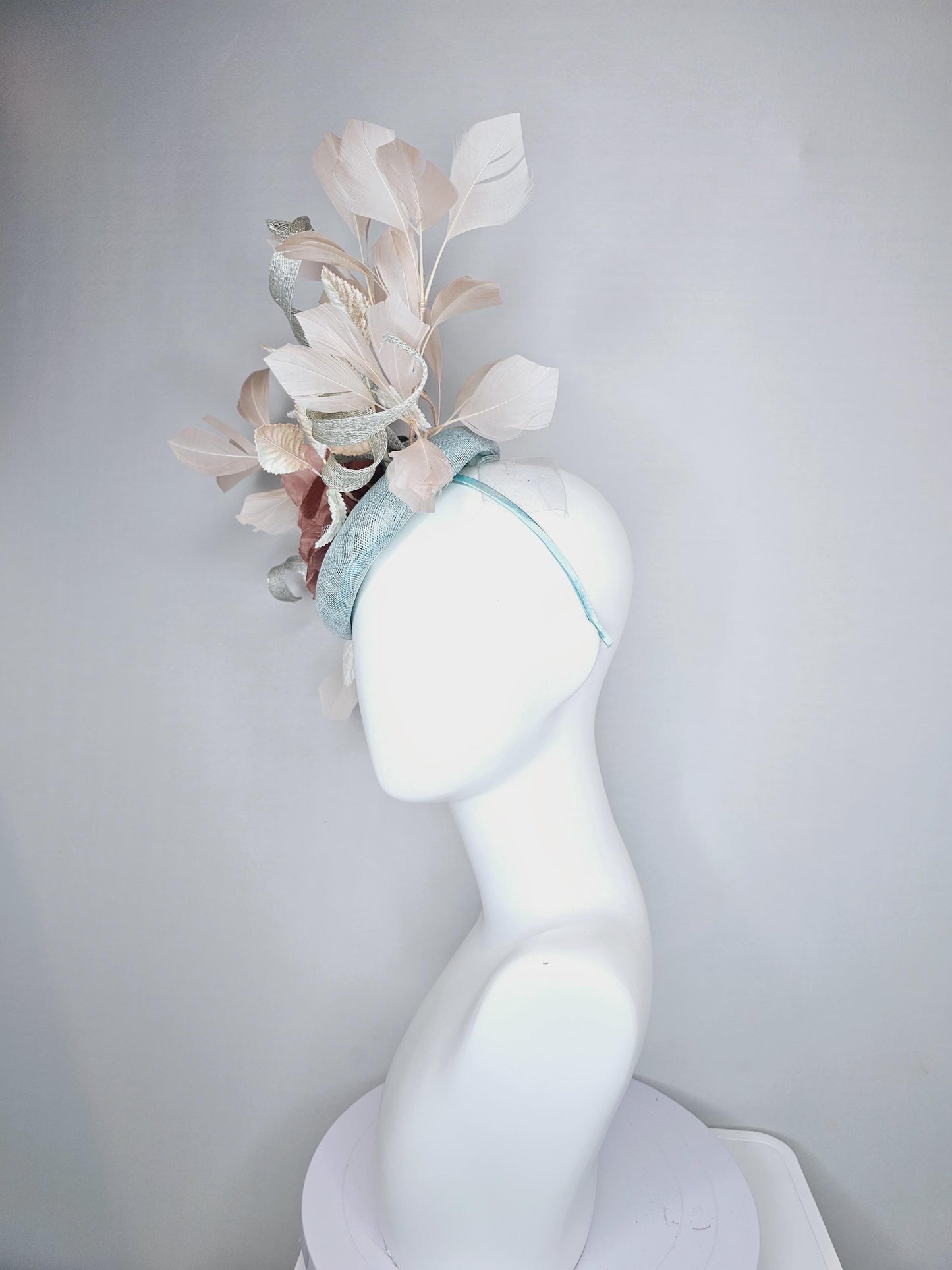 kentucky derby hat fascinator light blue sinamay with light beige branching feathers,cream velvet leaves, dusty pink rose silk satin flower