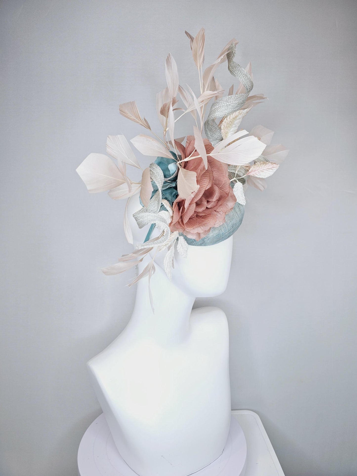 kentucky derby hat fascinator light blue sinamay with light beige branching feathers,cream velvet leaves, dusty pink rose silk satin flower