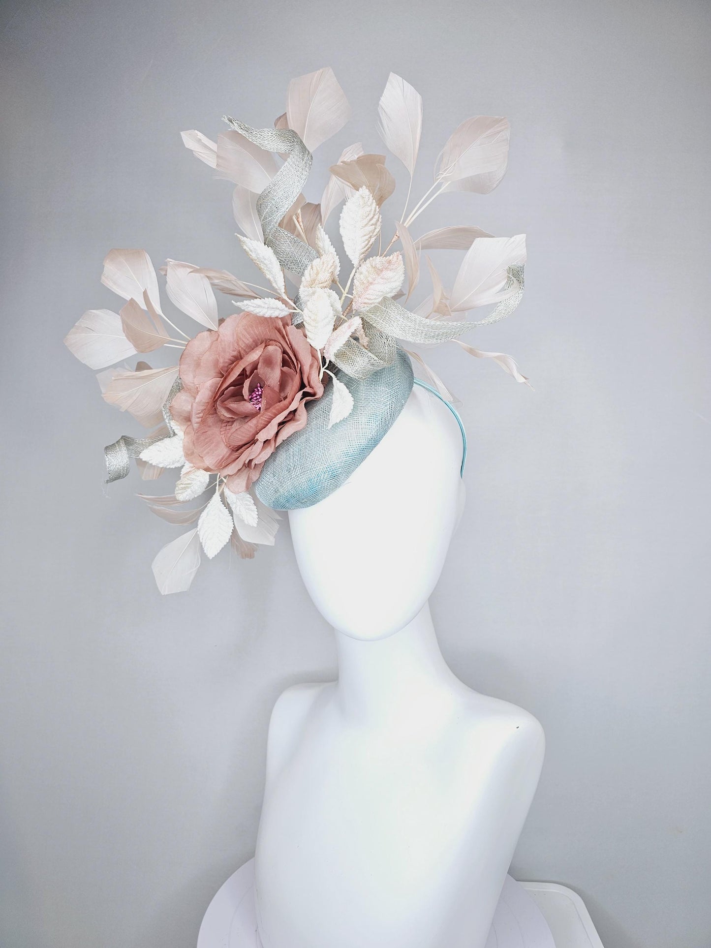 kentucky derby hat fascinator light blue sinamay with light beige branching feathers,cream velvet leaves, dusty pink rose silk satin flower