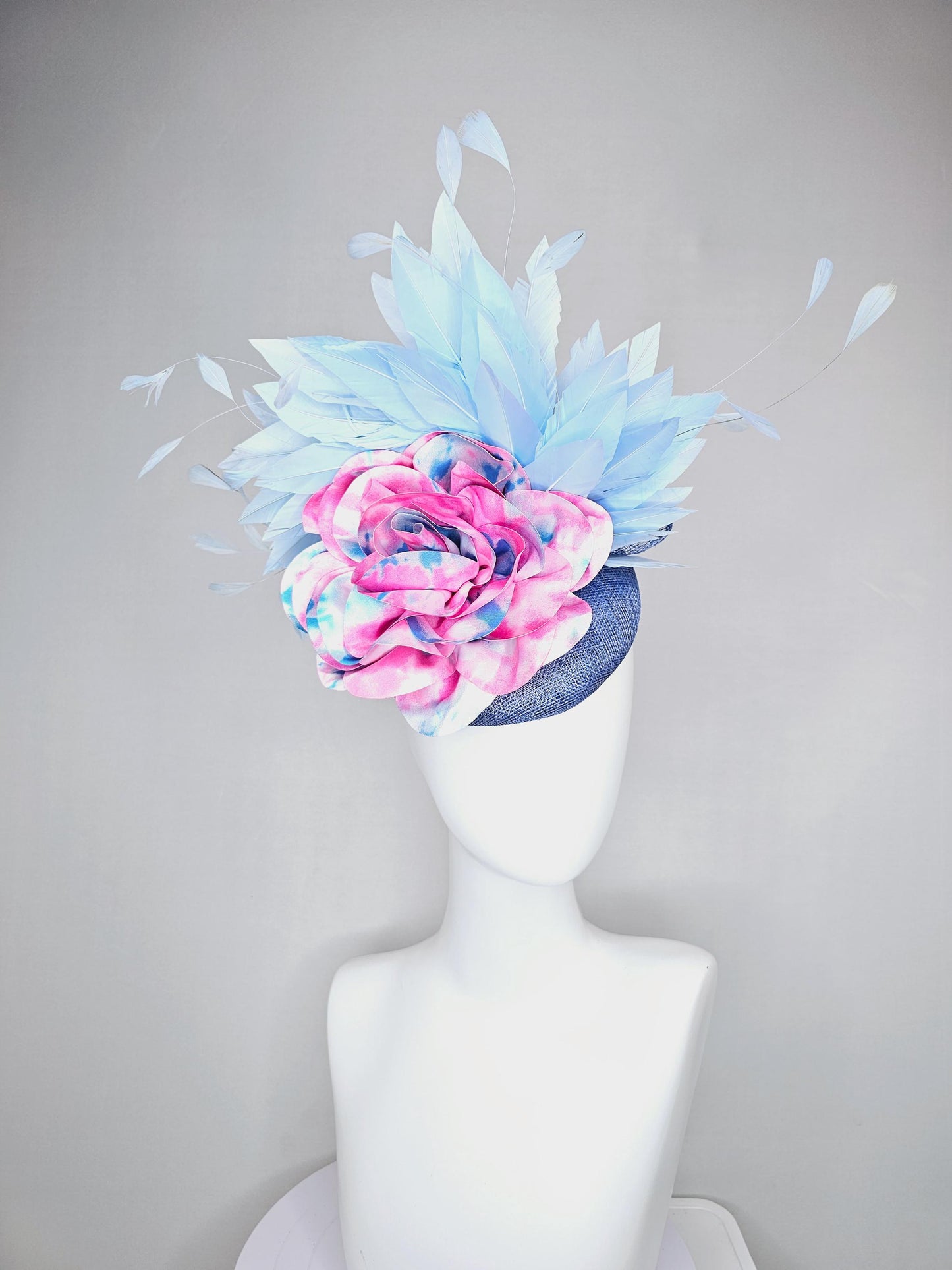 kentucky derby hat fascinator blue sinamay with light blue branching feathers and large pink and blue tie dye satin rose flower