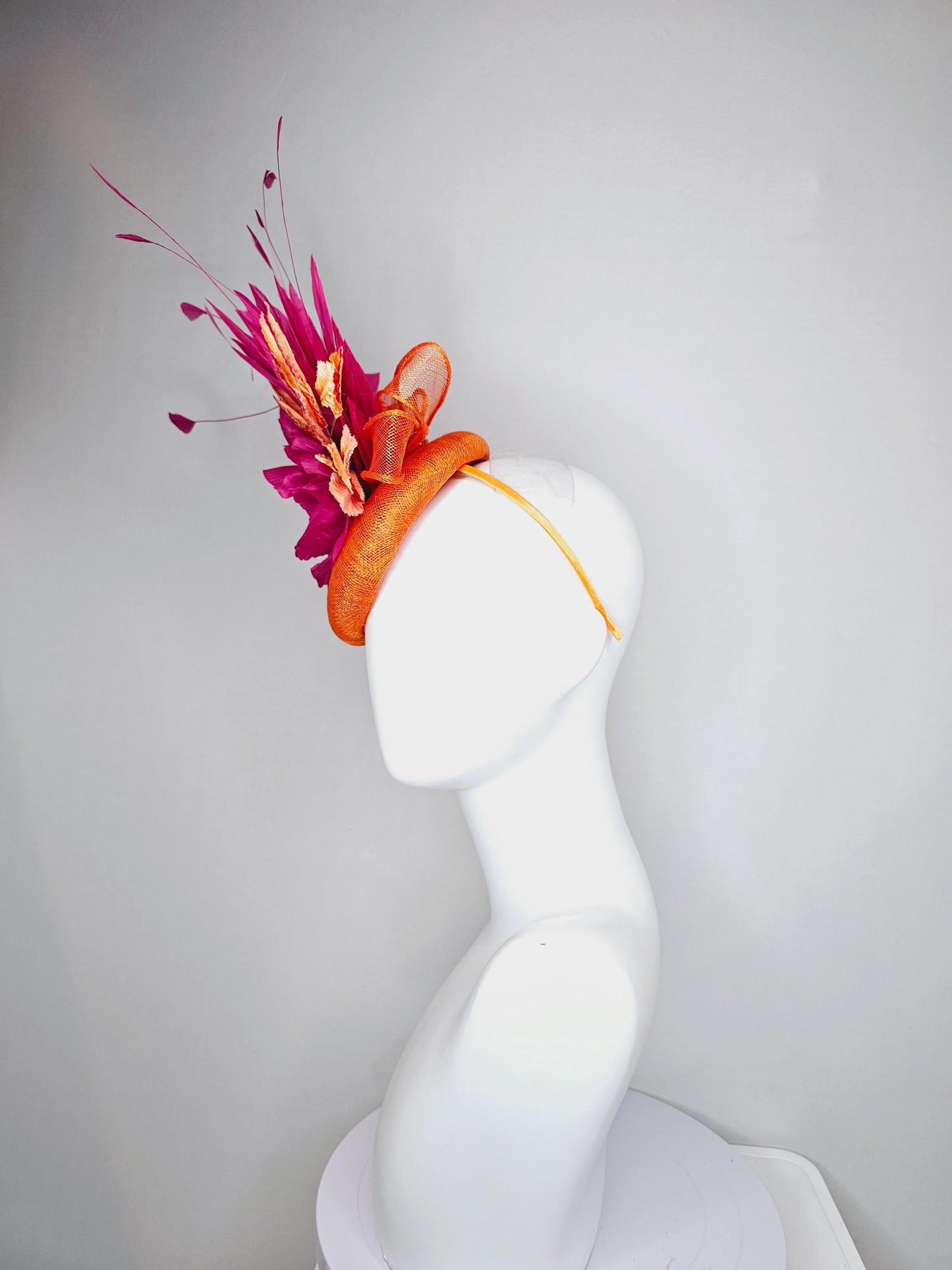 kentucky derby hat fascinator burnt orange sinamay with bright pink satin rose flower, red orange leaves, bright pink branching feathers