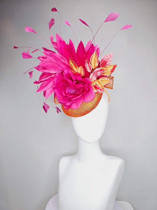 kentucky derby hat fascinator burnt orange sinamay with bright pink satin rose flower, red orange leaves, bright pink branching feathers