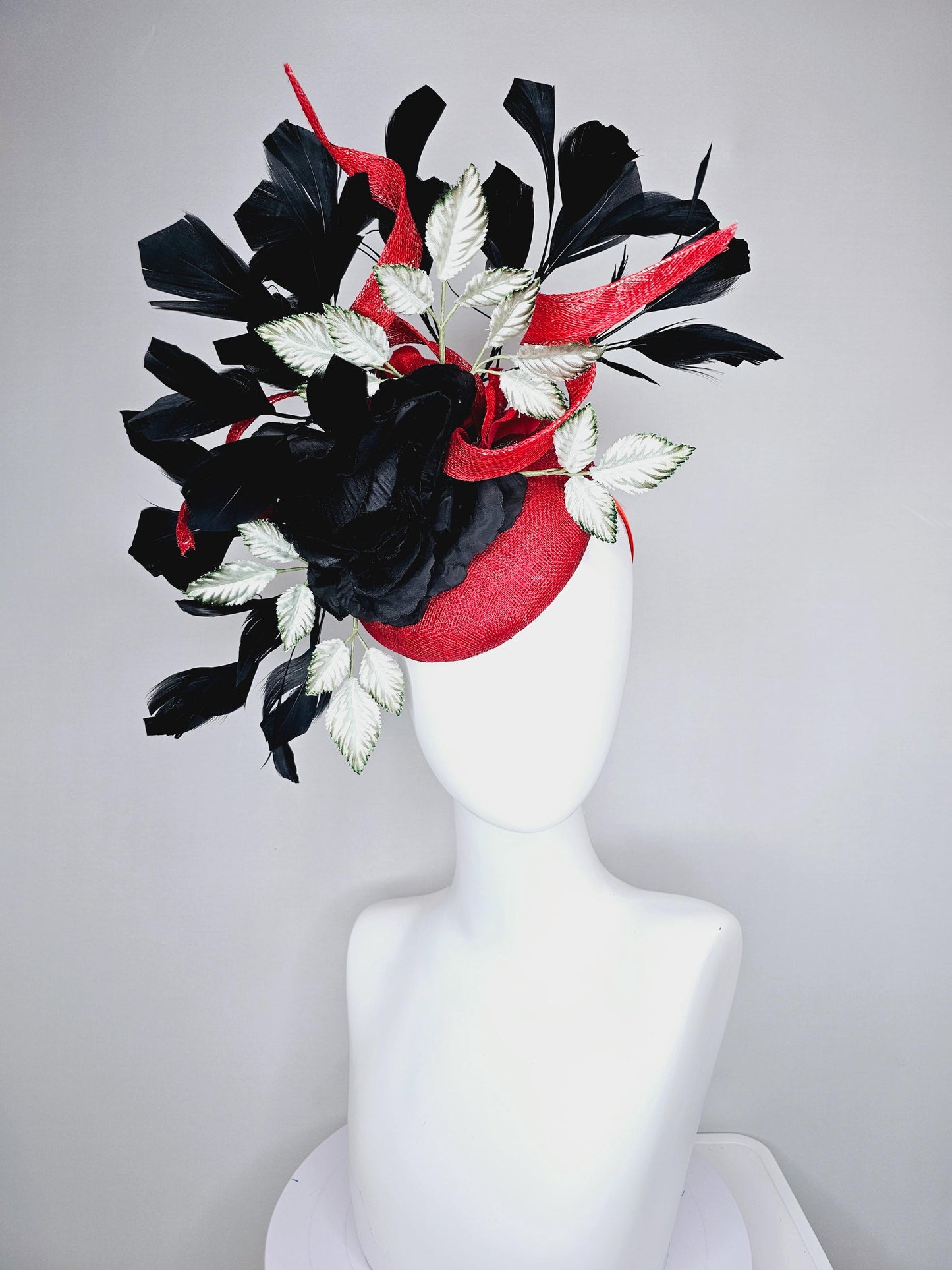 kentucky derby hat fascinator red sinamay base with red sinamay curls, black satin rose flower, ombre green leaves, black branching feathers