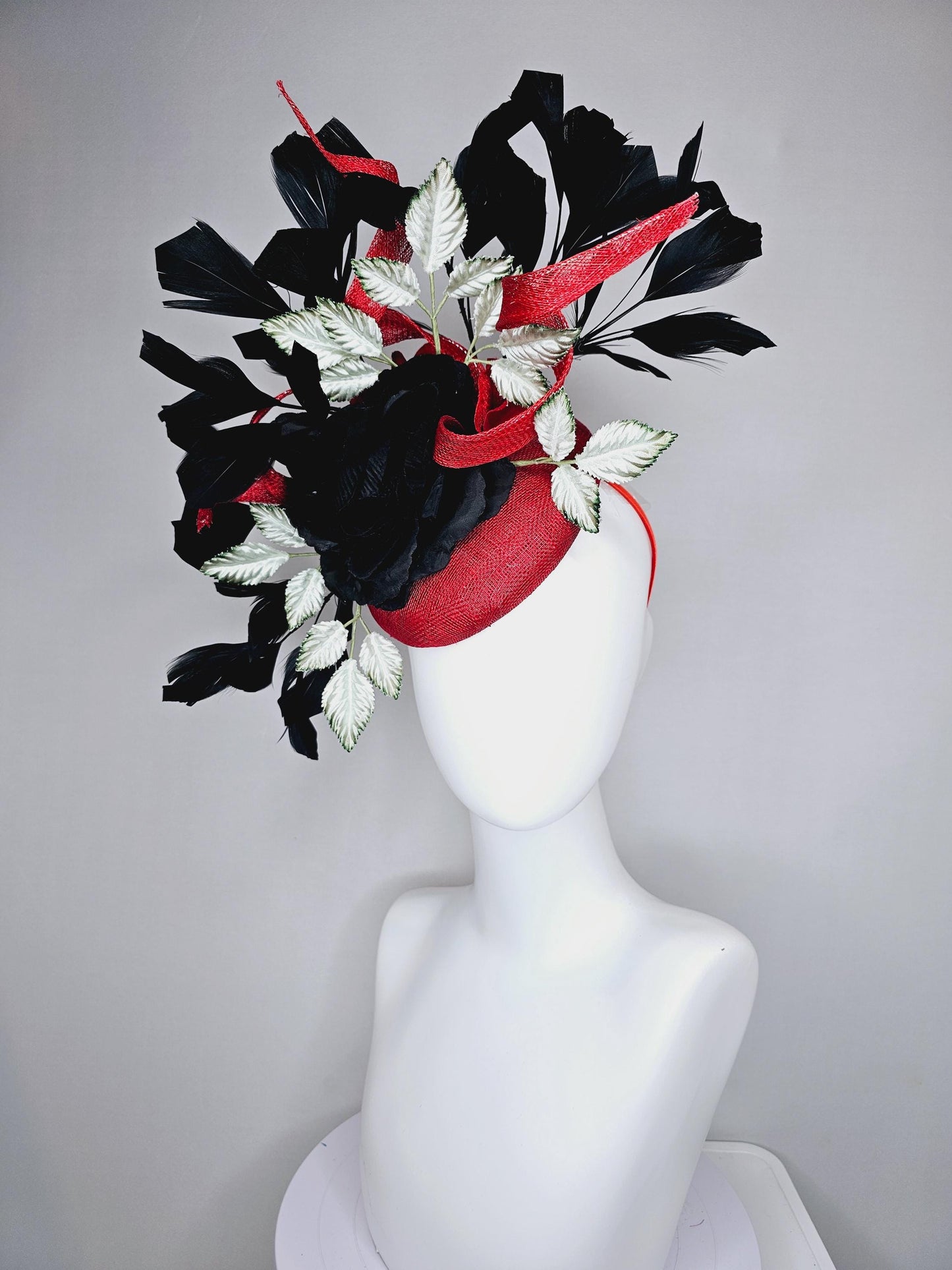 kentucky derby hat fascinator red sinamay base with red sinamay curls, black satin rose flower, ombre green leaves, black branching feathers