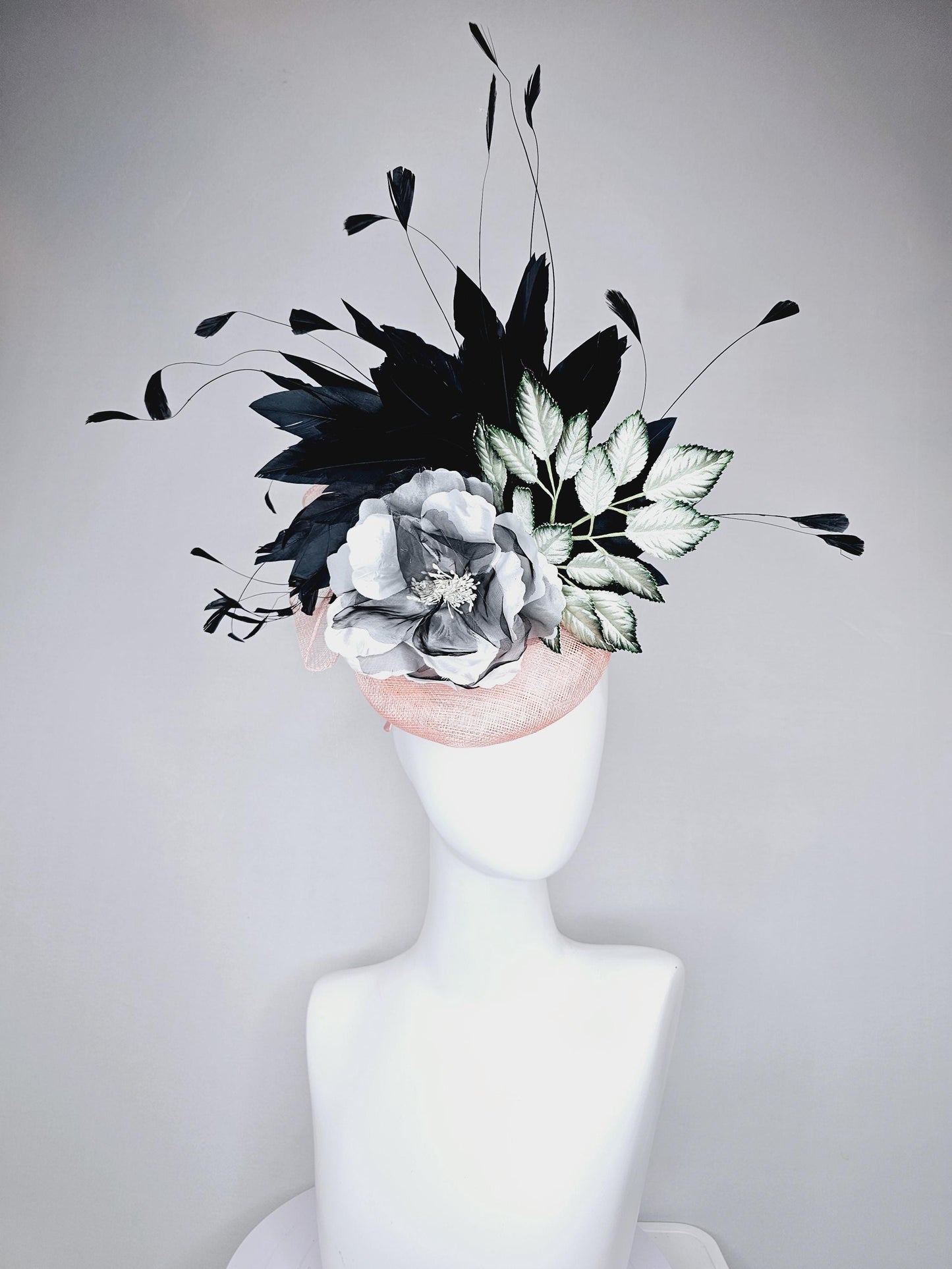 kentucky derby hat fascinator light pink sinamay with black and white organza flower, ombre black green leaves, black branching feathers