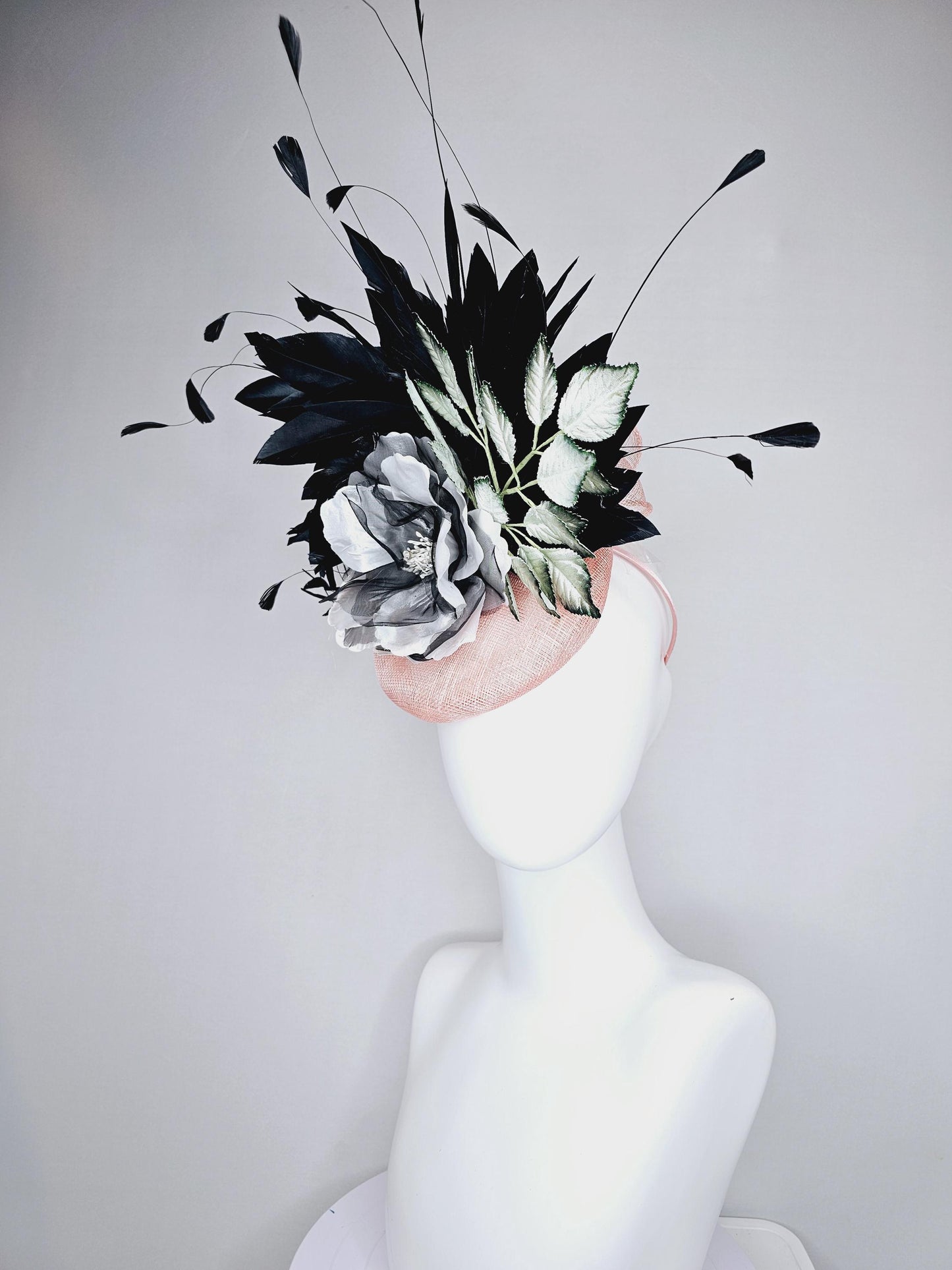 kentucky derby hat fascinator light pink sinamay with black and white organza flower, ombre black green leaves, black branching feathers