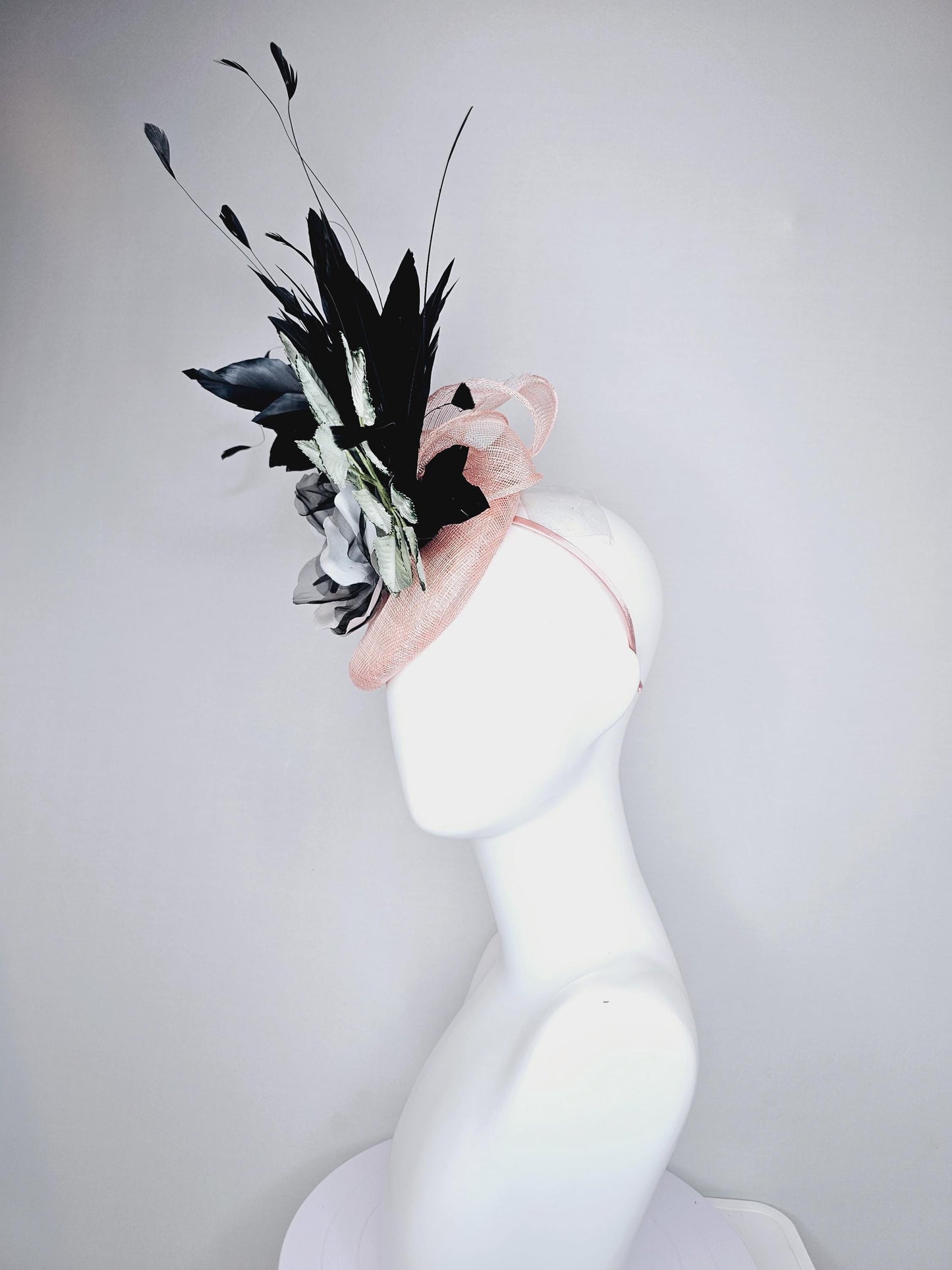 kentucky derby hat fascinator light pink sinamay with black and white organza flower, ombre black green leaves, black branching feathers