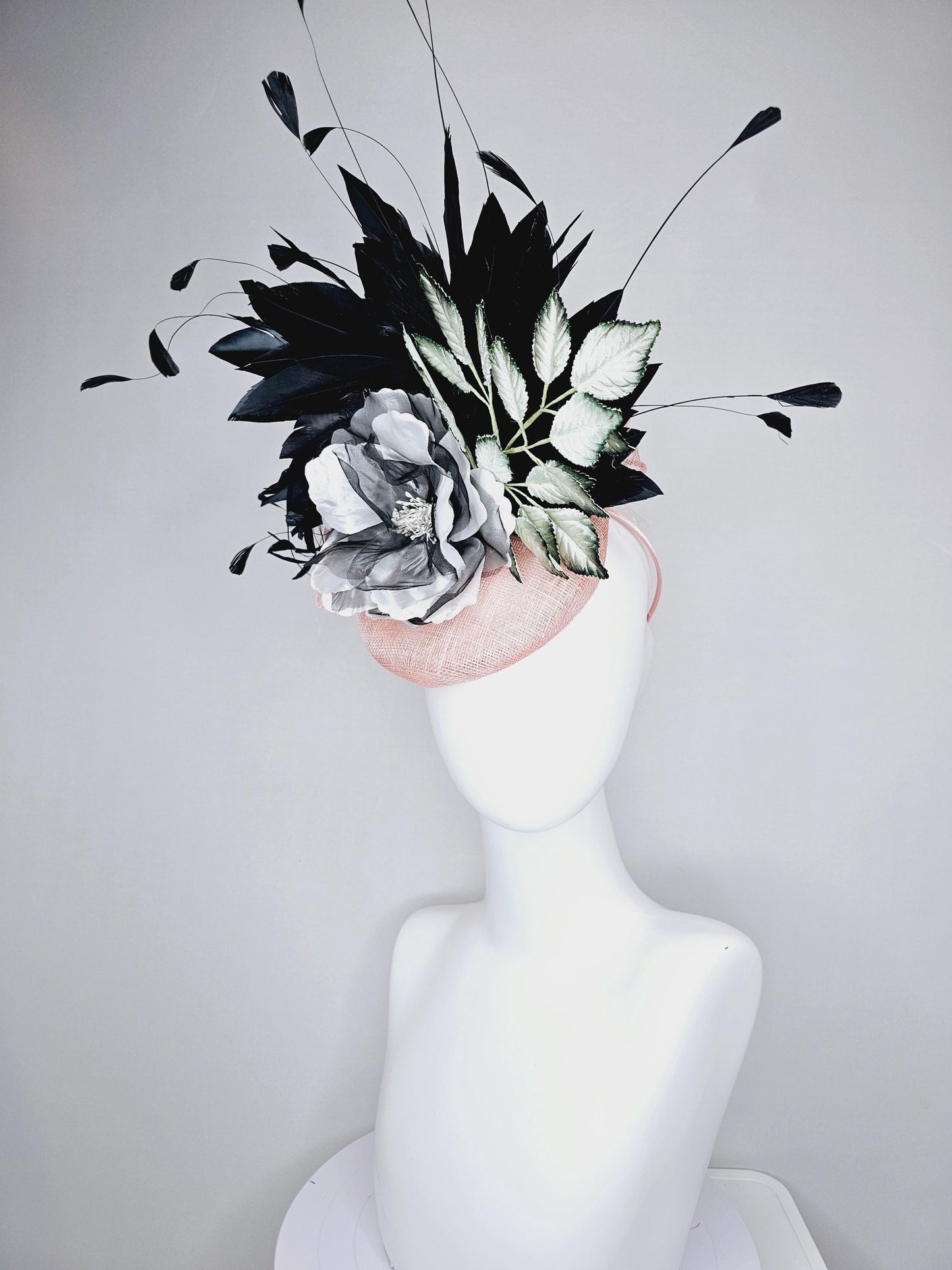 kentucky derby hat fascinator light pink sinamay with black and white organza flower, ombre black green leaves, black branching feathers